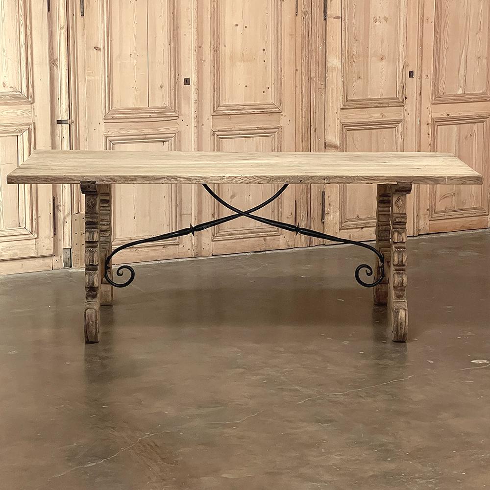 19th Century Spanish dining table in stripped oak features all the classic elements of the region, using techniques handed down from generation to generation for centuries! Old-growth oak was harvested in thick planks to create the piece, with the
