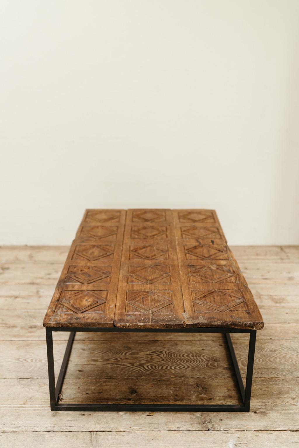 a 19th century wooden door from Aragon/Spain, now put on a contemporary iron base,
can be used as coffee table, beautiful worn patina, sturdy. 