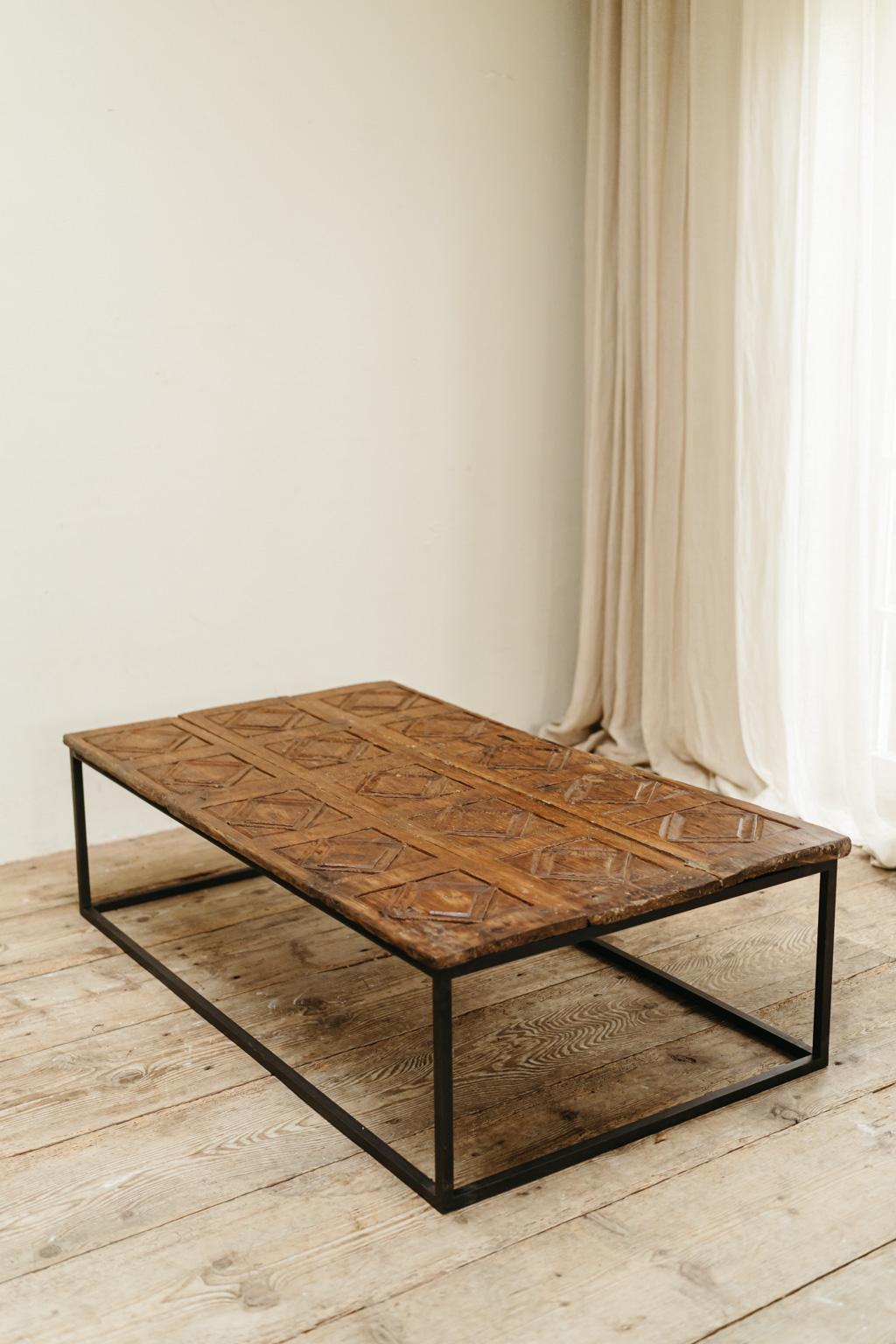 19th century Spanish door, now made into a coffee table, contemporary iron base  In Good Condition For Sale In Brecht, BE
