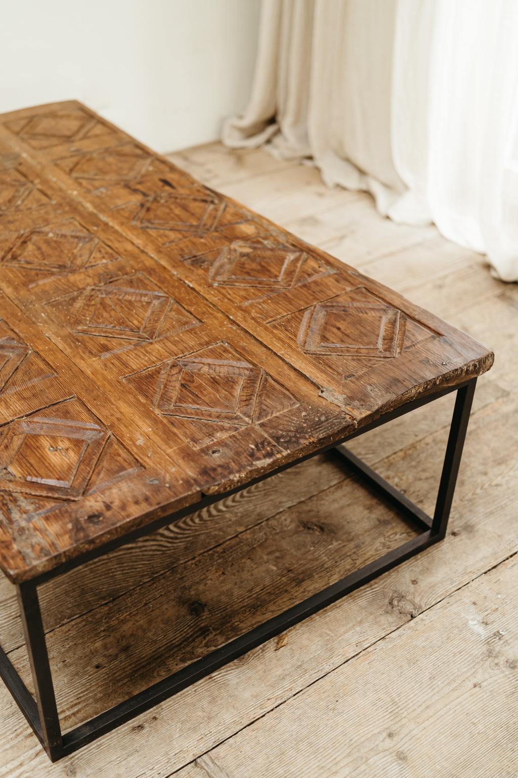 Fruitwood 19th century Spanish door, now made into a coffee table, contemporary iron base  For Sale