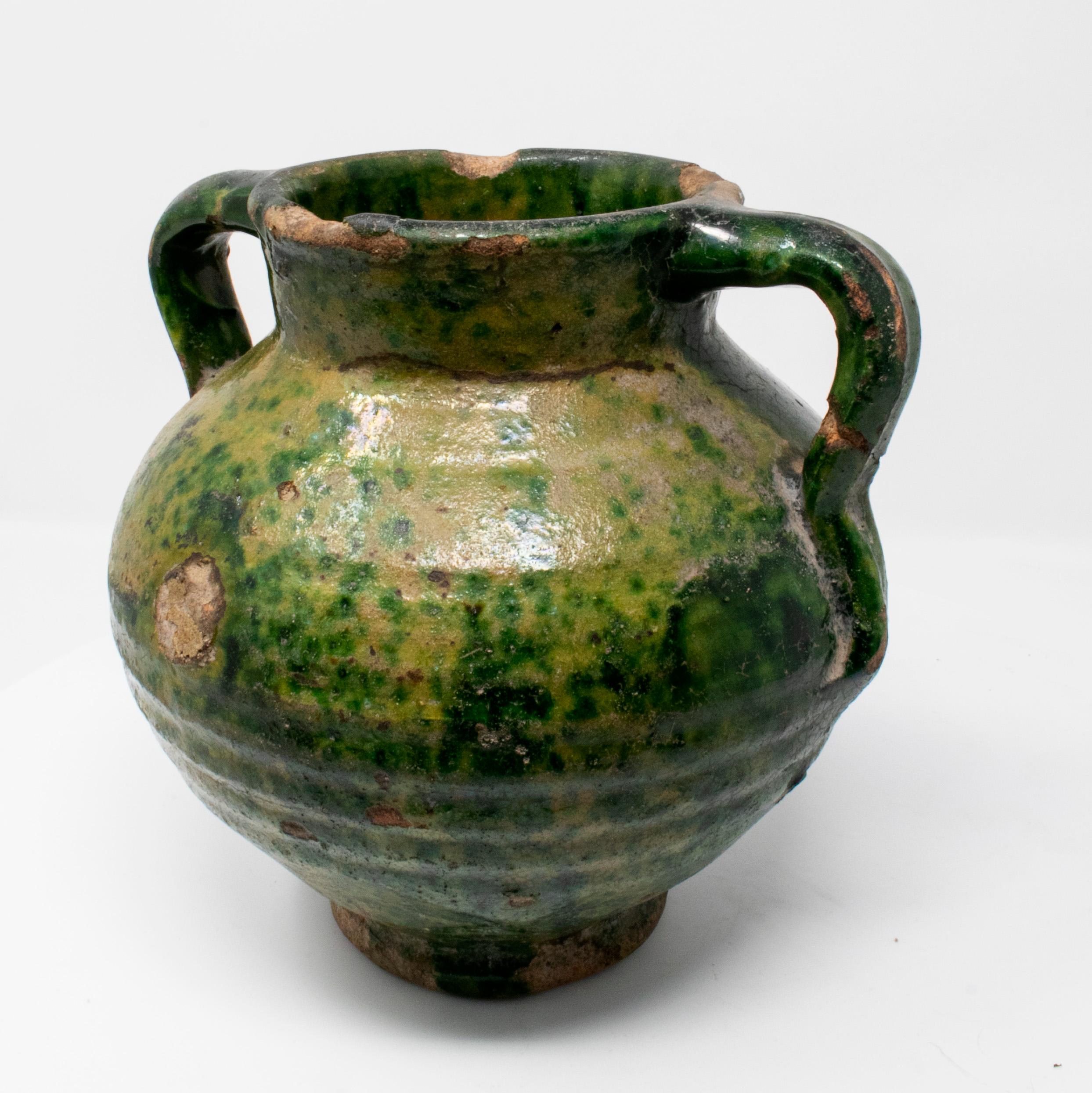 19th century Spanish green glazed ceramic vase with handles.