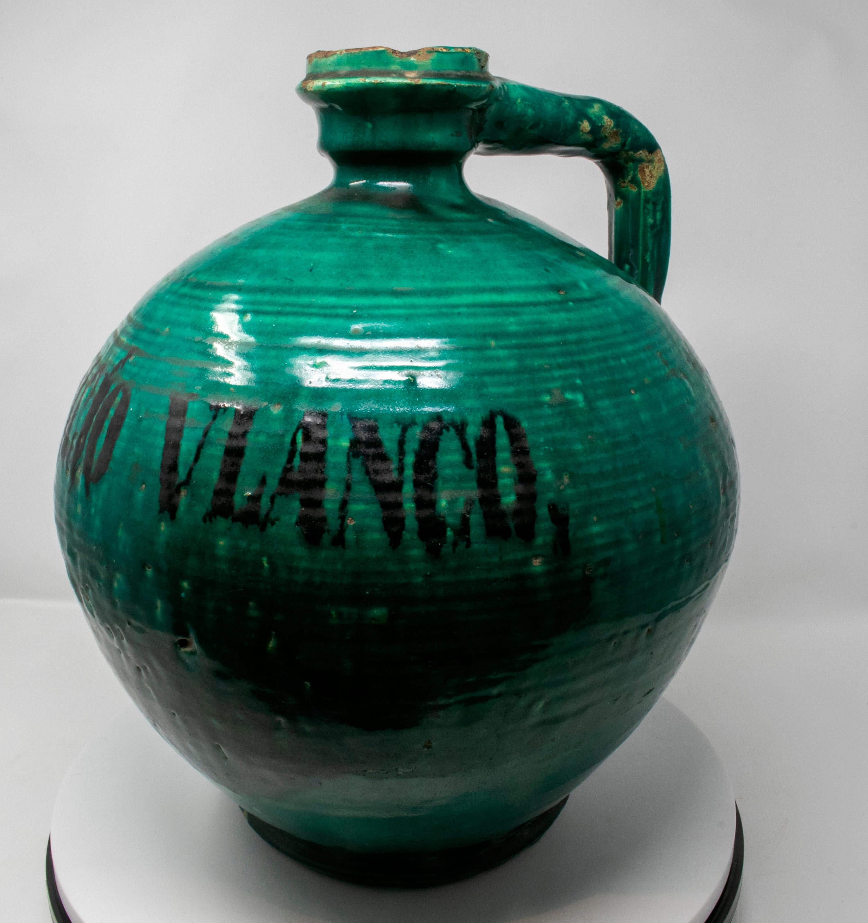 19th century Spanish green glazed closed vase reading 