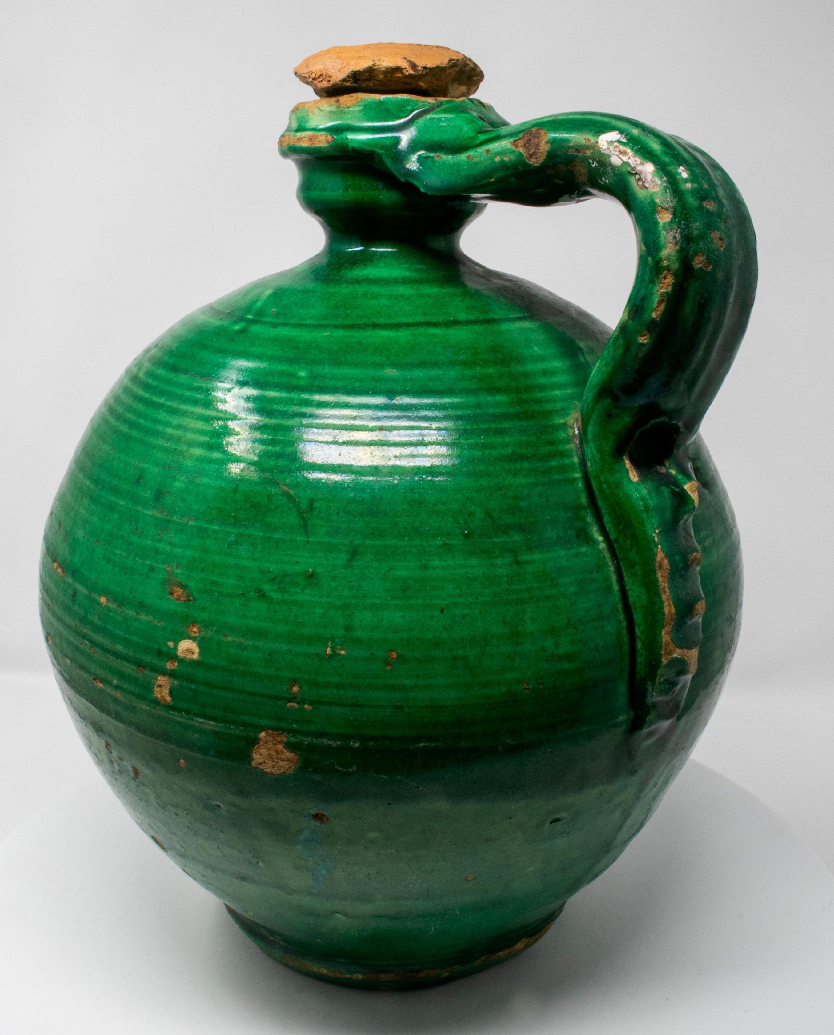 19th century Spanish green glazed closed vase with original lid.