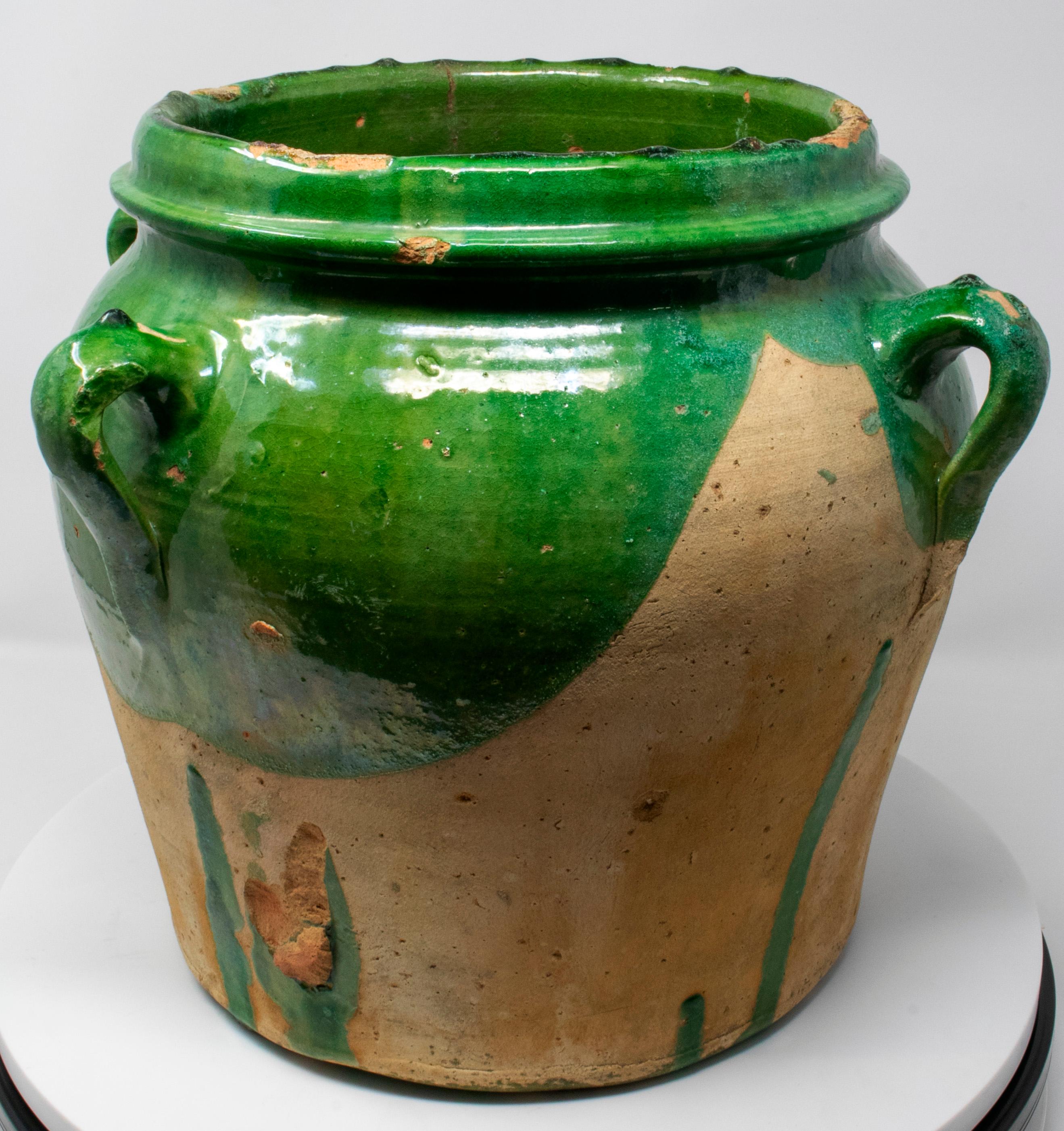 19th century Spanish green glazed vase with four handles.