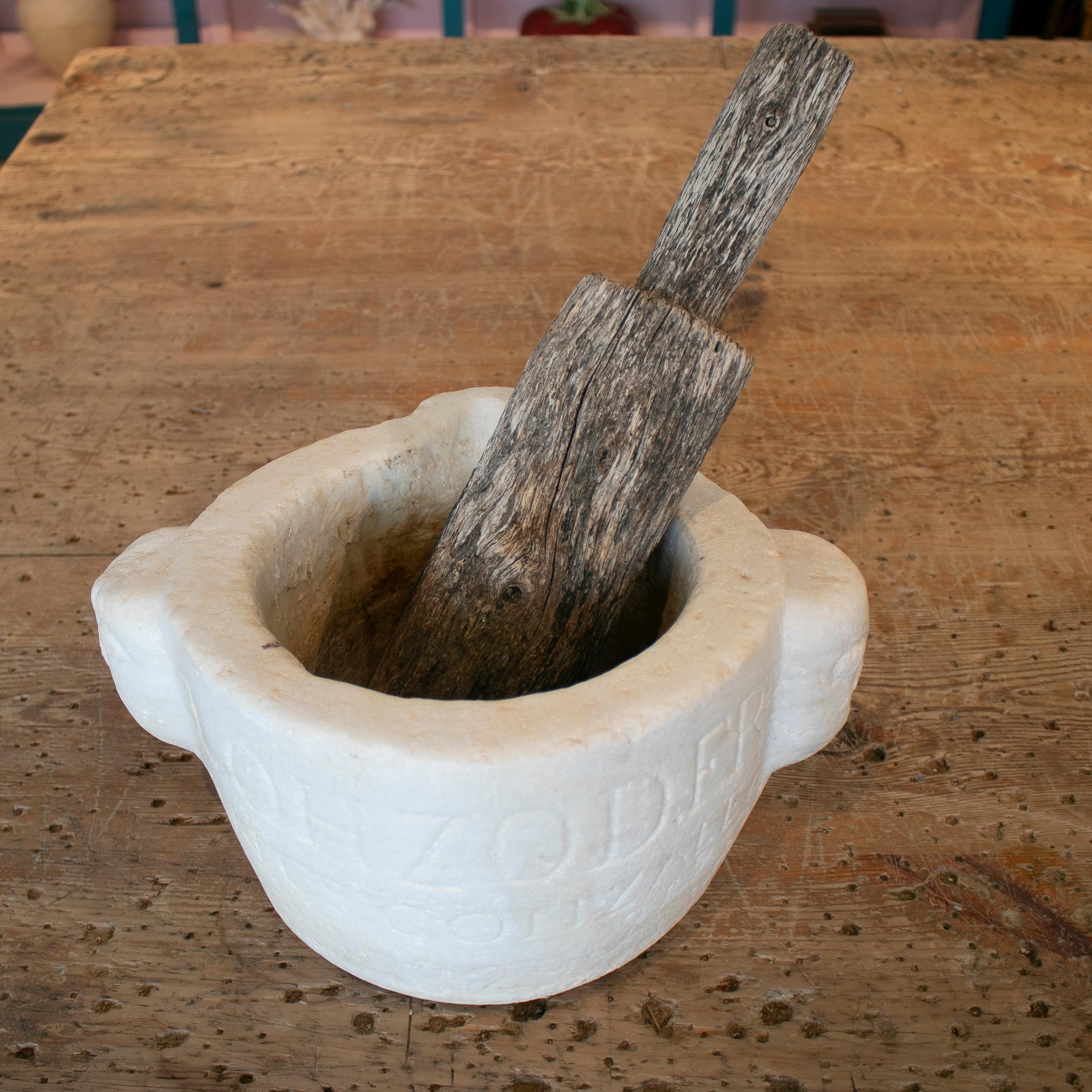 Antique 19th century Spanish hand carved inscribed marble stone mortar with wooden pestle.