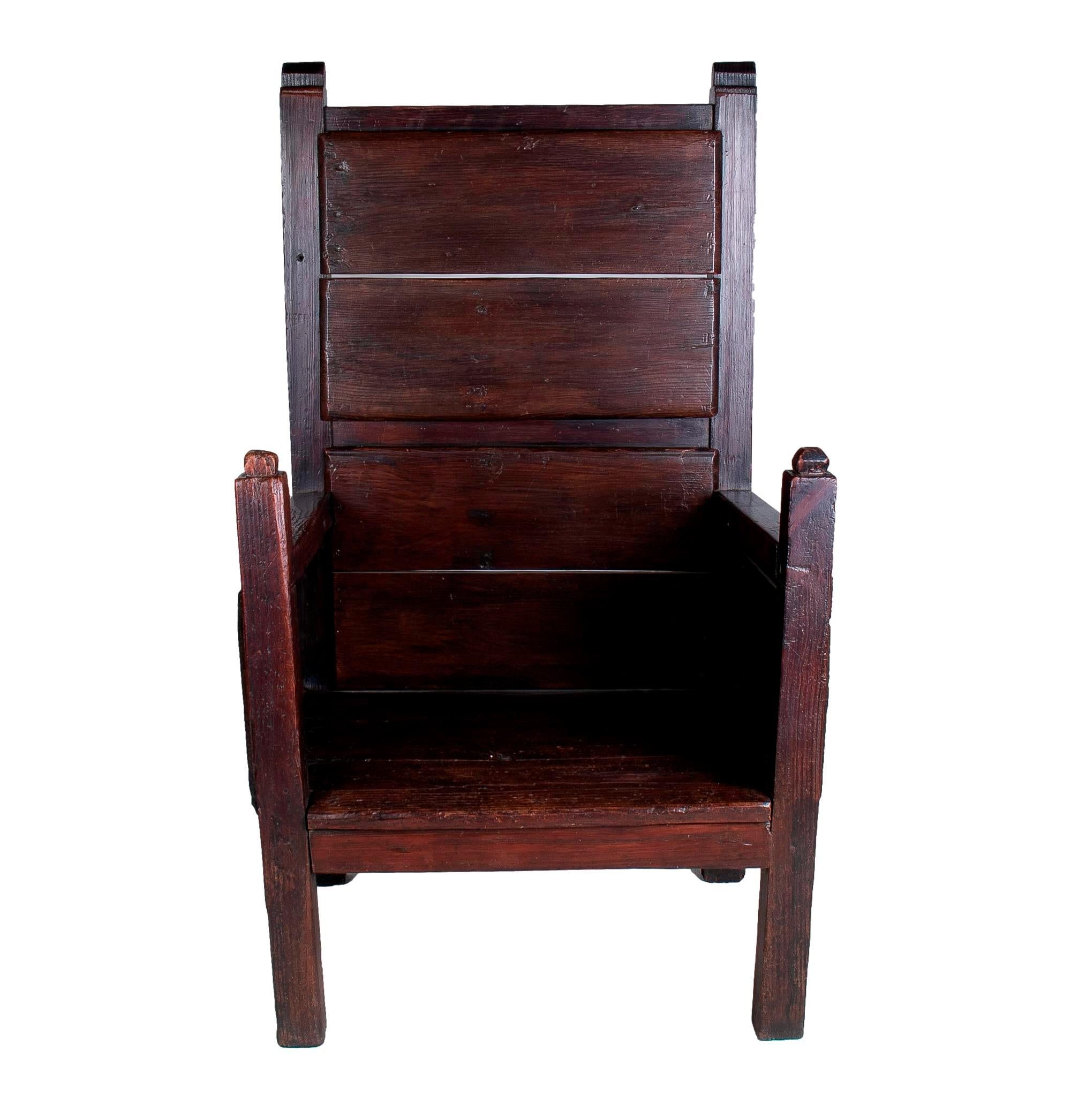 Rustic 19th century Spanish handmade wooden sofa chair with tall back rest.