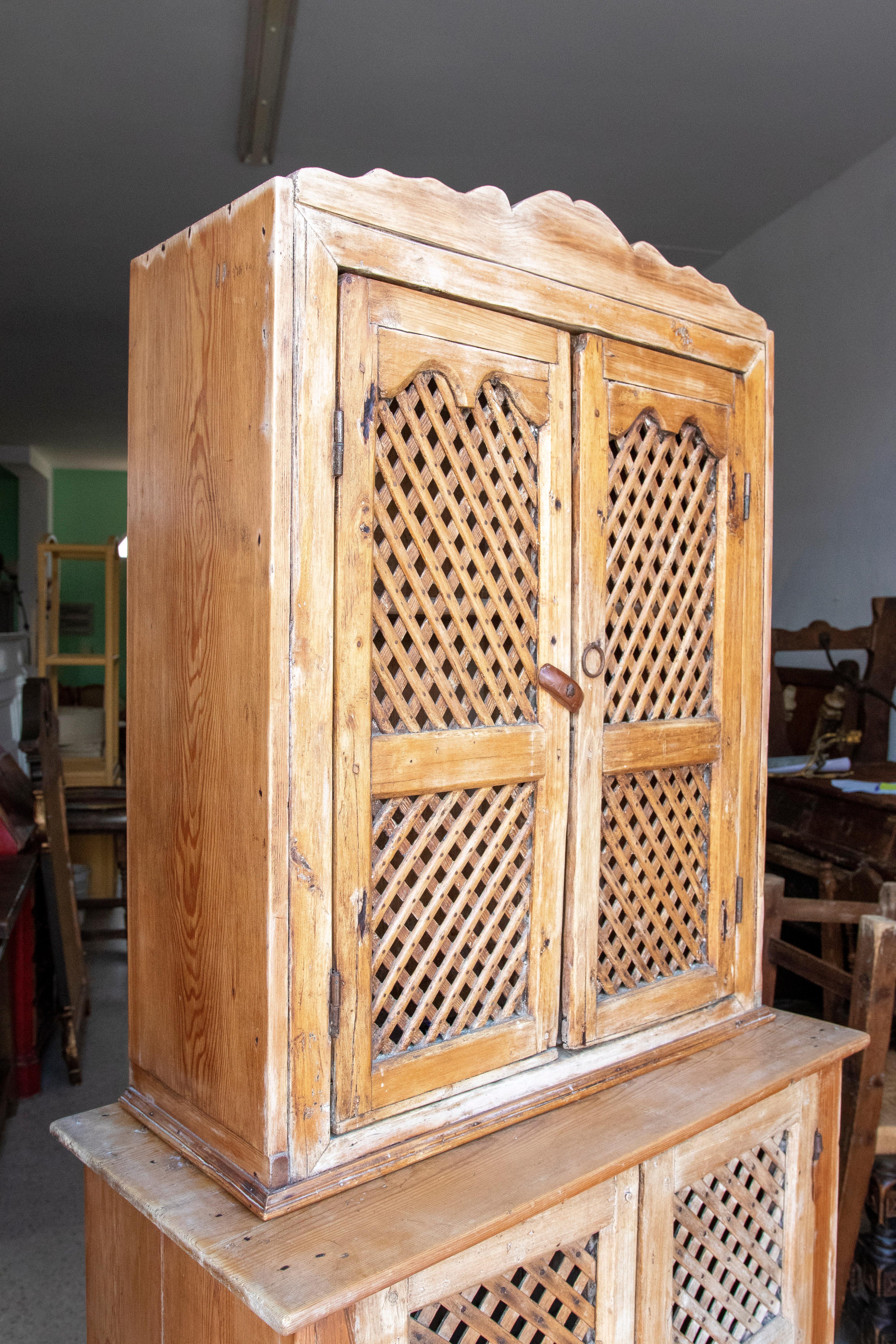 19th century Spanish kitchen cupboard with louvered doors.