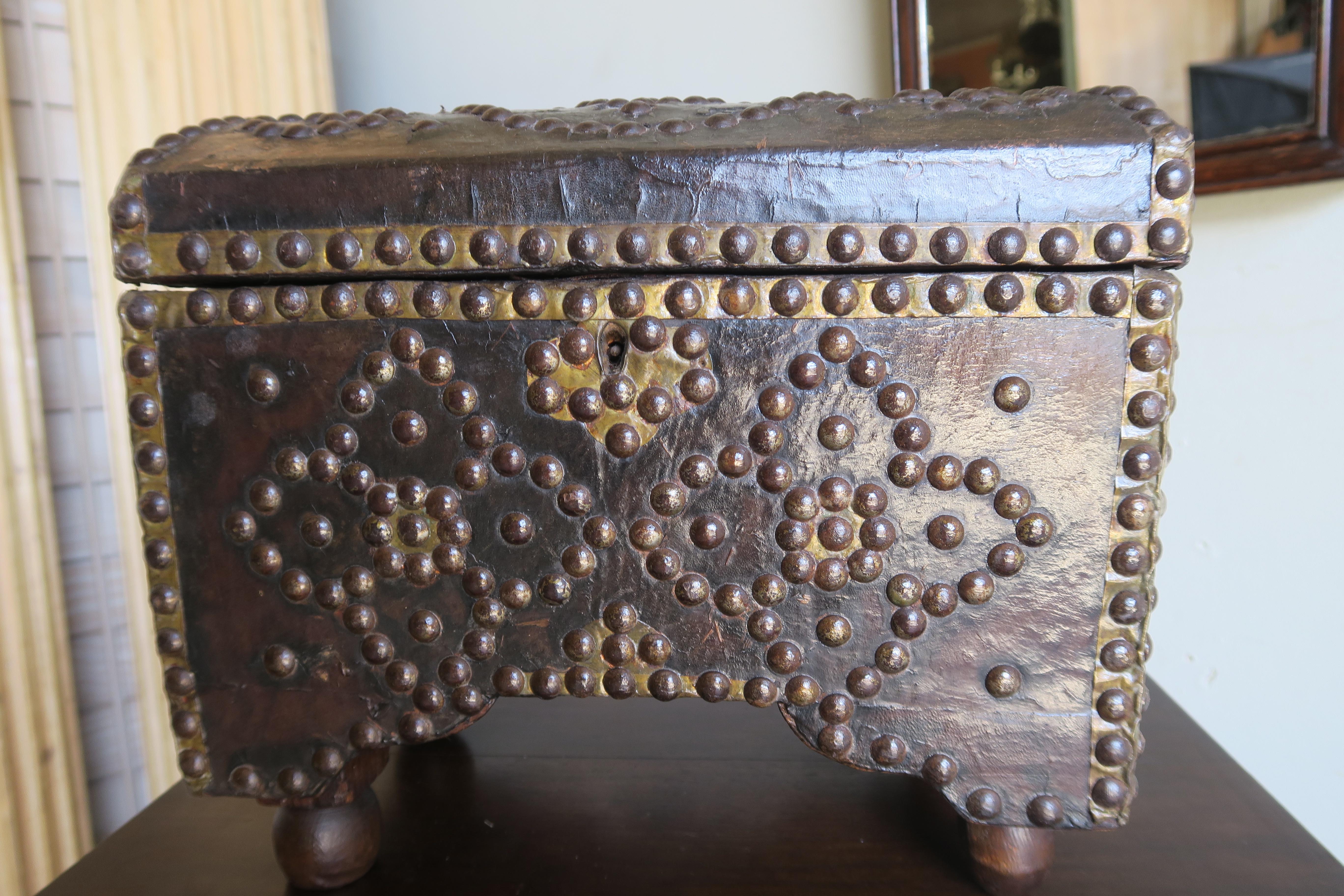 19th century Spanish leather domed shaped box with studded detailing throughout.