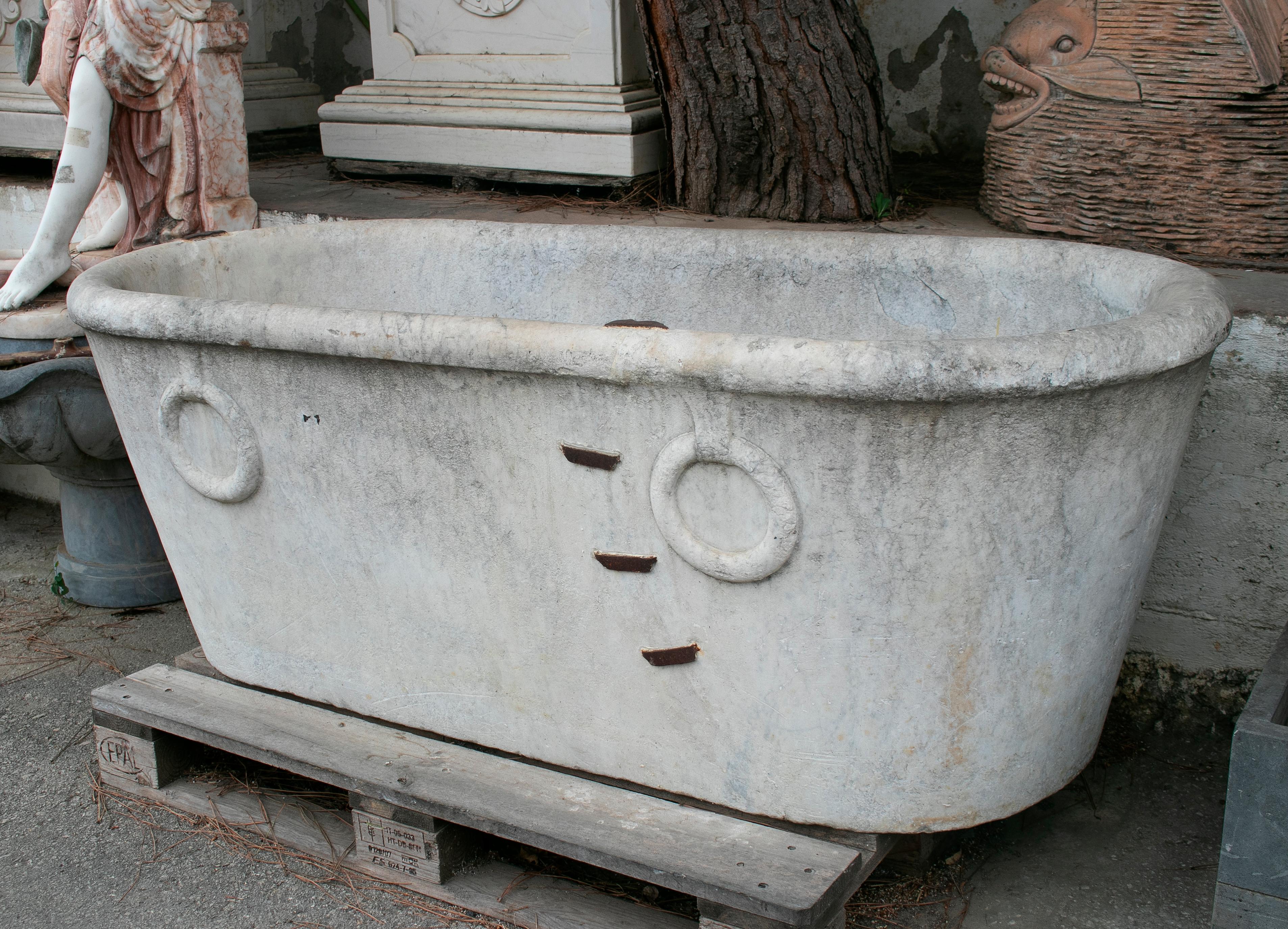 19th century Spanish one block solid marble bath with rings, repaired and restored using antique iron grapples.