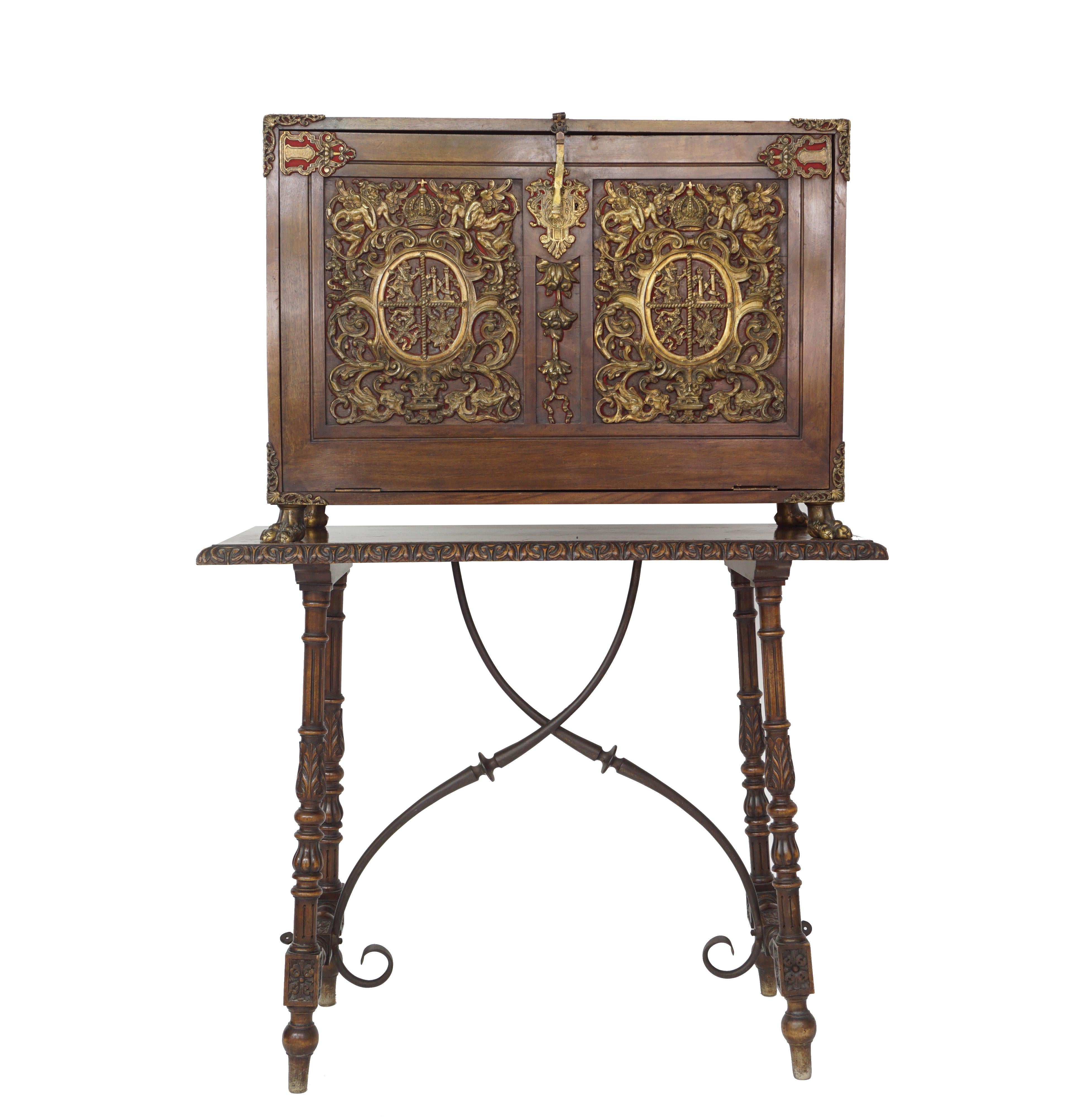 Exceptional 19th century Renaissance Style Vargueno on stand.
Of classical design this papelero style vargueno, serves well as a book case, the front cover lid depicts a pair of spectacular heraldic seals in cast bronze.
Follows the line of