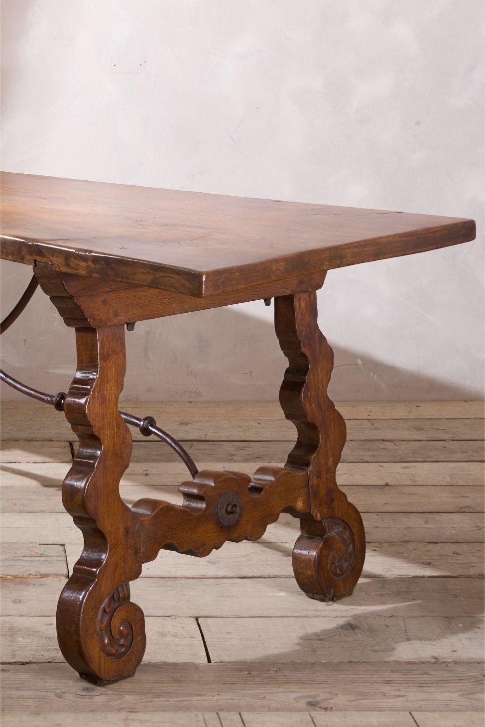 This is a great quality 19th century Spanish dining table. Lovely typically Spanish design that has iron supports. But the main feature of the single plank oak top. Full of character and originality. Clean condition as well.

Height 76cm Length