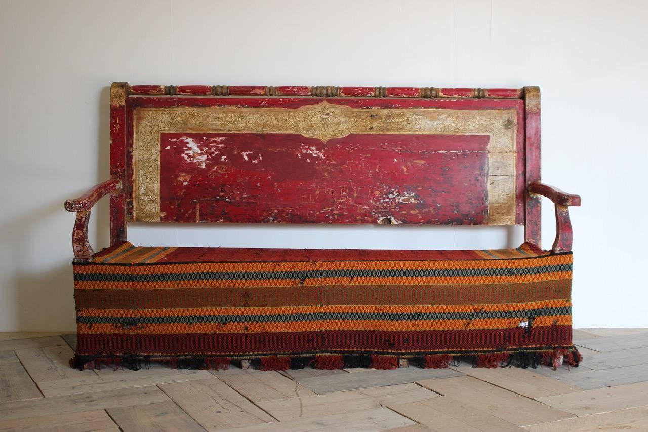 A superb, 19th century Spanish painted hall bench of great proportions, retaining the original painted decoration and of Moorish influence that will make a statement in most settings.
The bench comes from the southern Spain region of Andalucía.