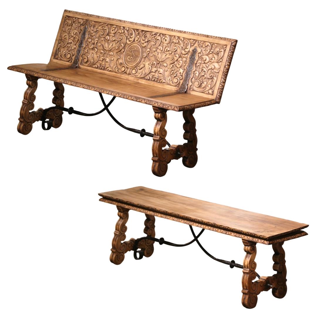 Decorate a hallway or entry with this elegant antique bench. Crafted in Spain circa 1880 and built of chestnut wood, the bench stands on carved legs ending with round feet. Both ox yoke supports are joined with a double forged iron cross stretcher