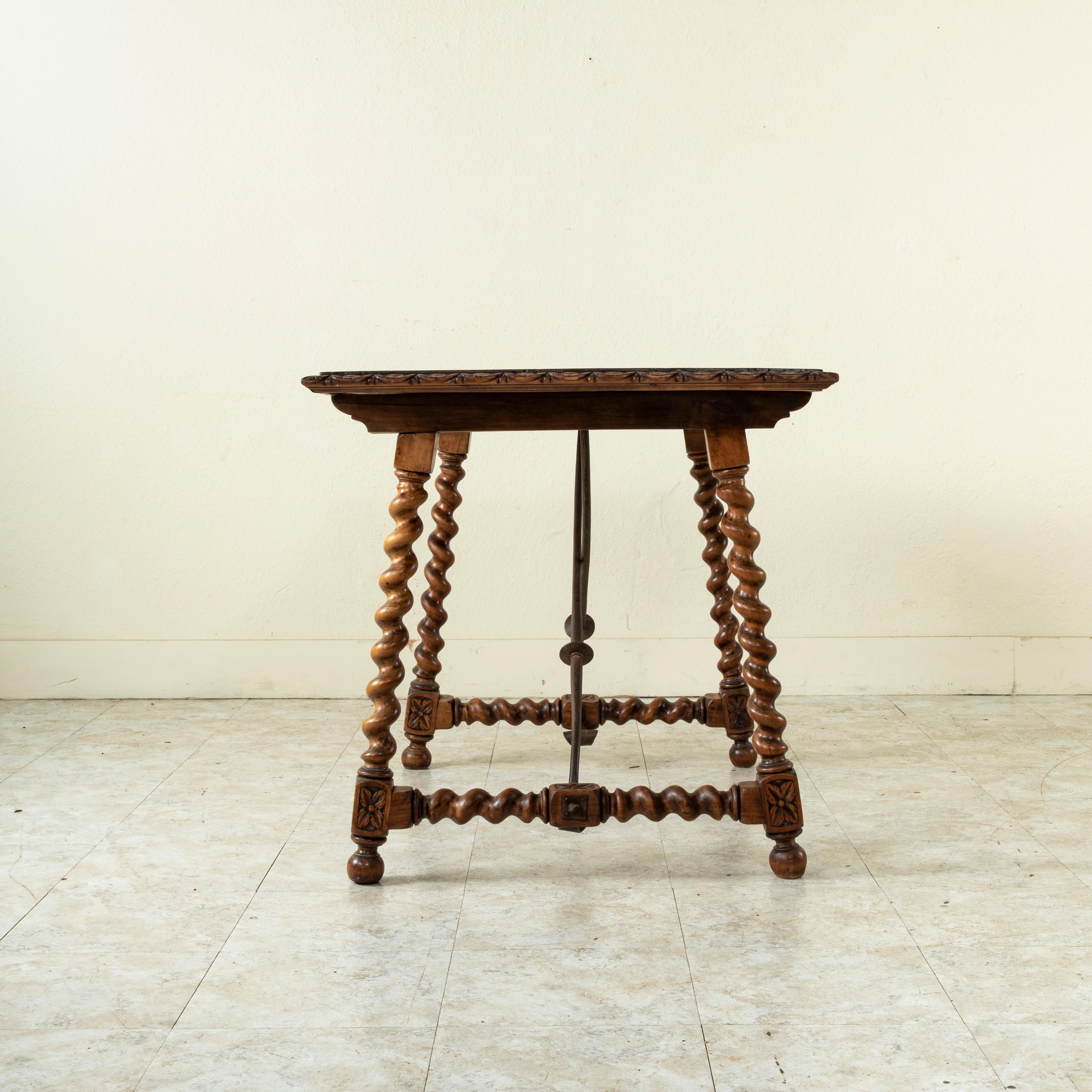 Hand-Carved 19th Century Spanish Renaissance Style Walnut Table with Forged Iron Stretcher For Sale