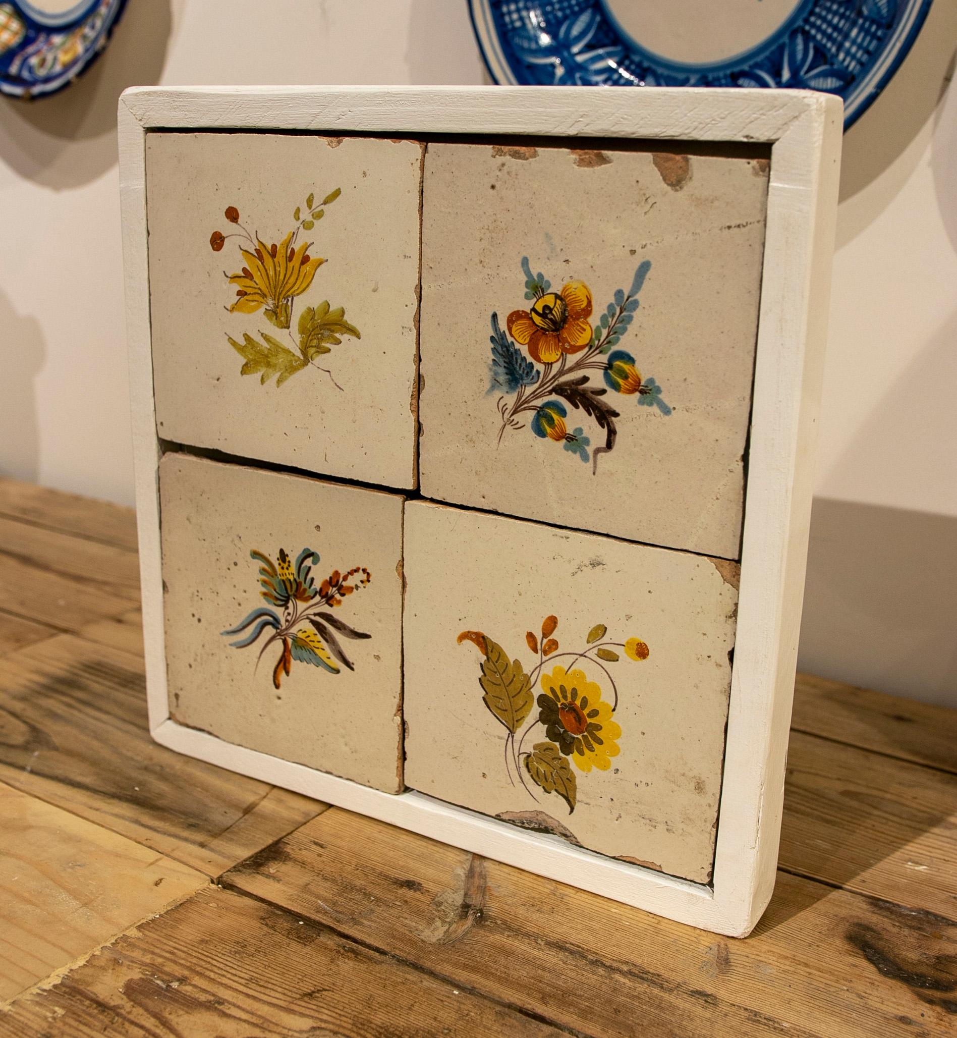 19th Century Spanish set of four hand-painted framed tiles.
The frame measures 37x36cm.