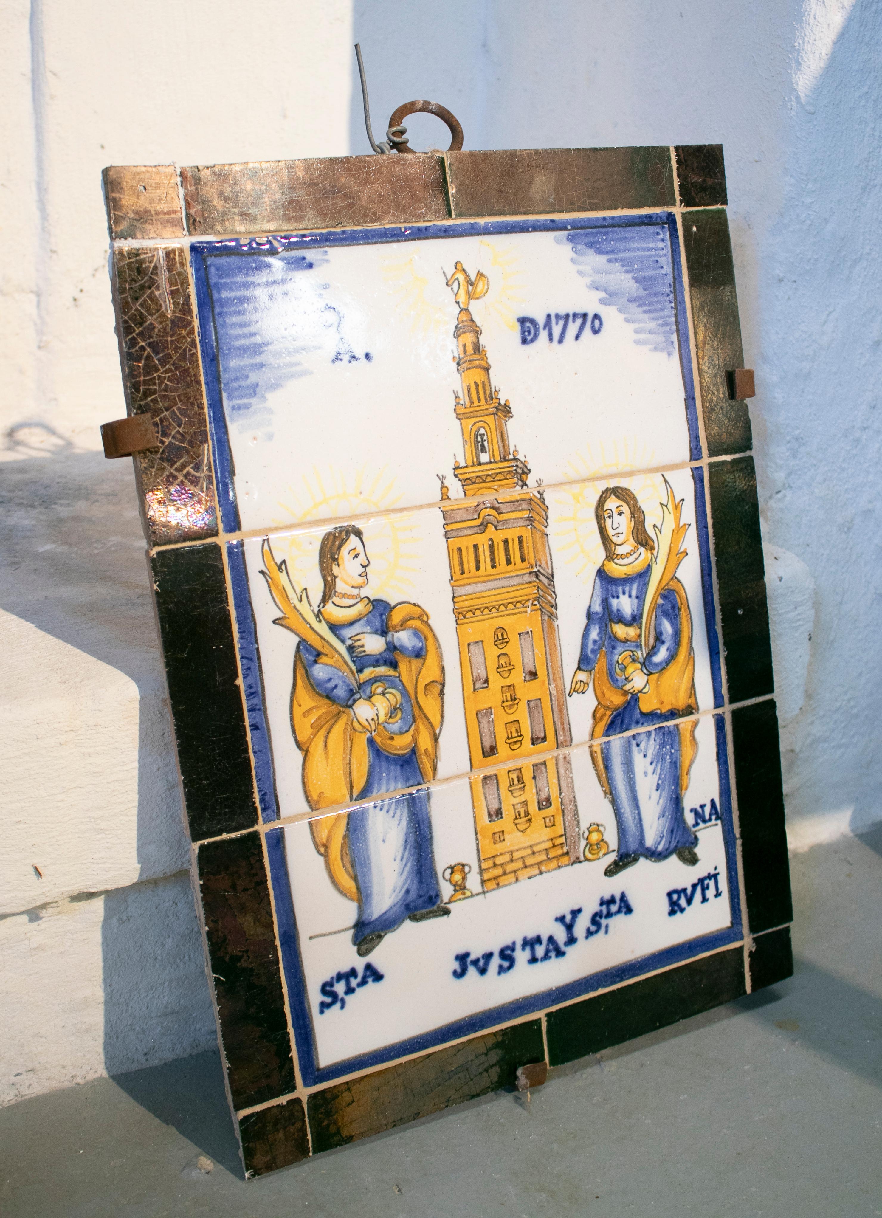 19th century Spanish Sevillian hand painted glazed ceramic representing Saints Justa and Rufina.