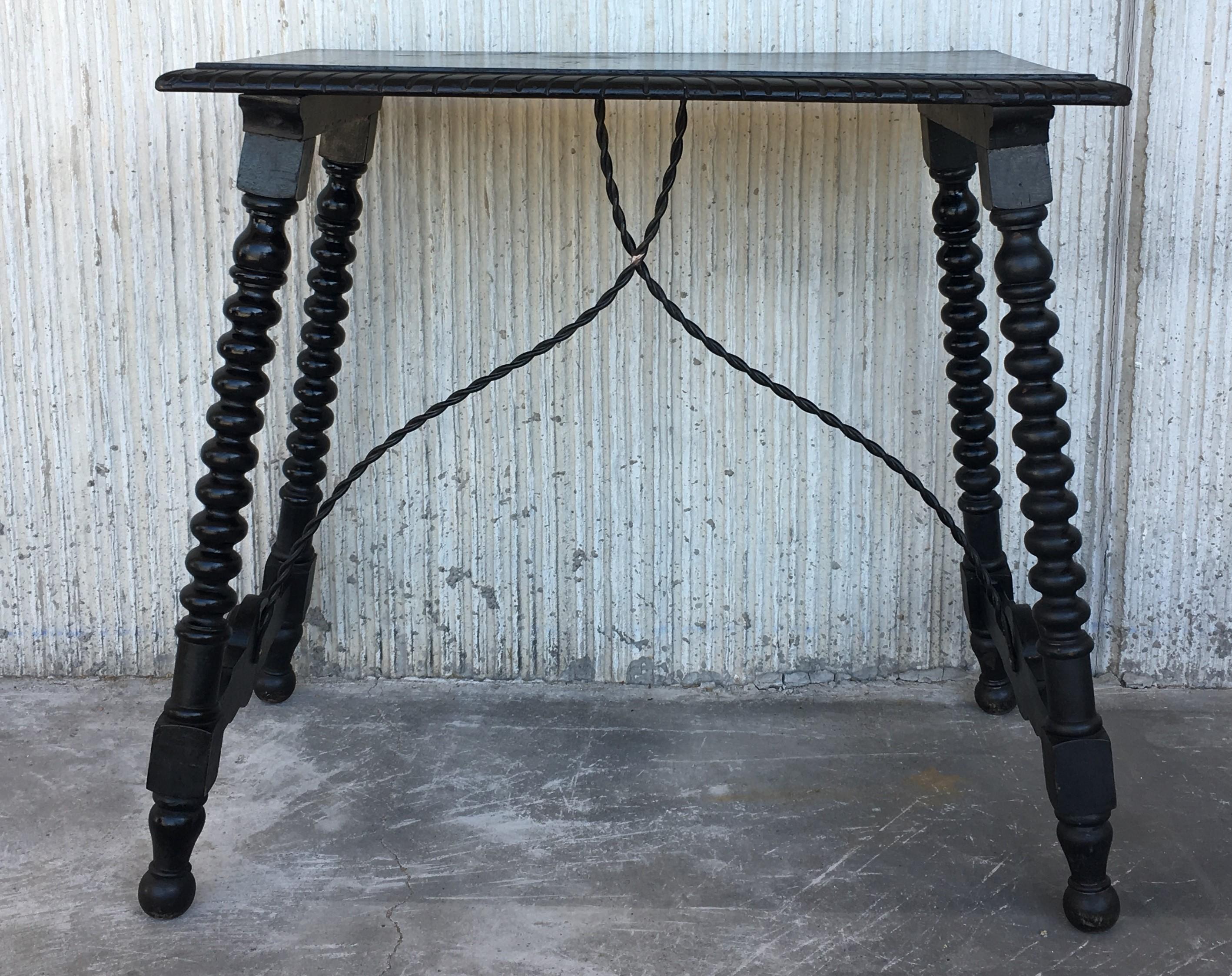 19th century Spanish side table.
19th century Spanish trestle table in walnut and iron. This piece has a great scale, lovely turned legs and iron stretcher. The top is made from a single piece of wood. This table could be used as an end table,