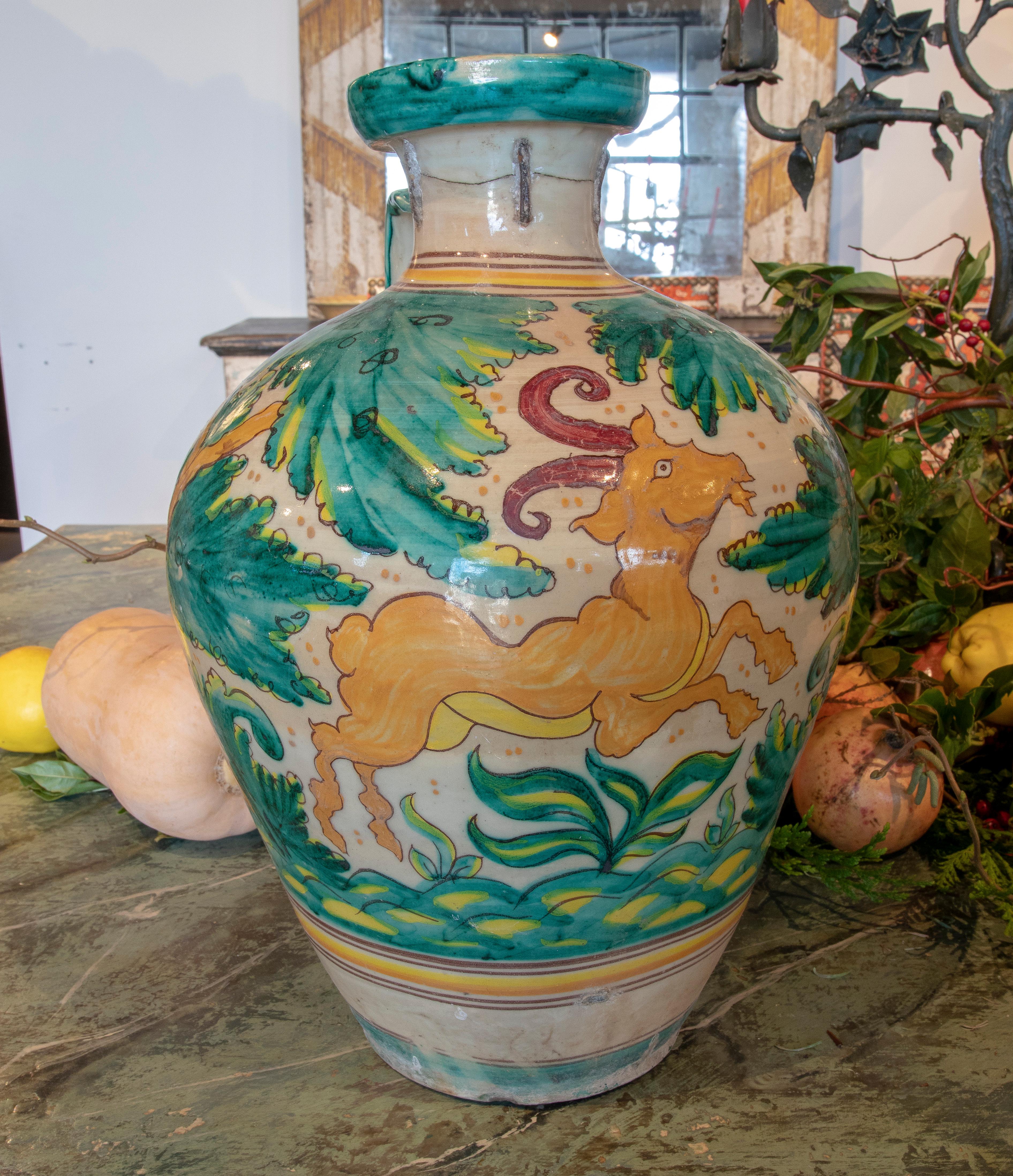 19th century Spanish Talavera ceramic vase with plants and goat.