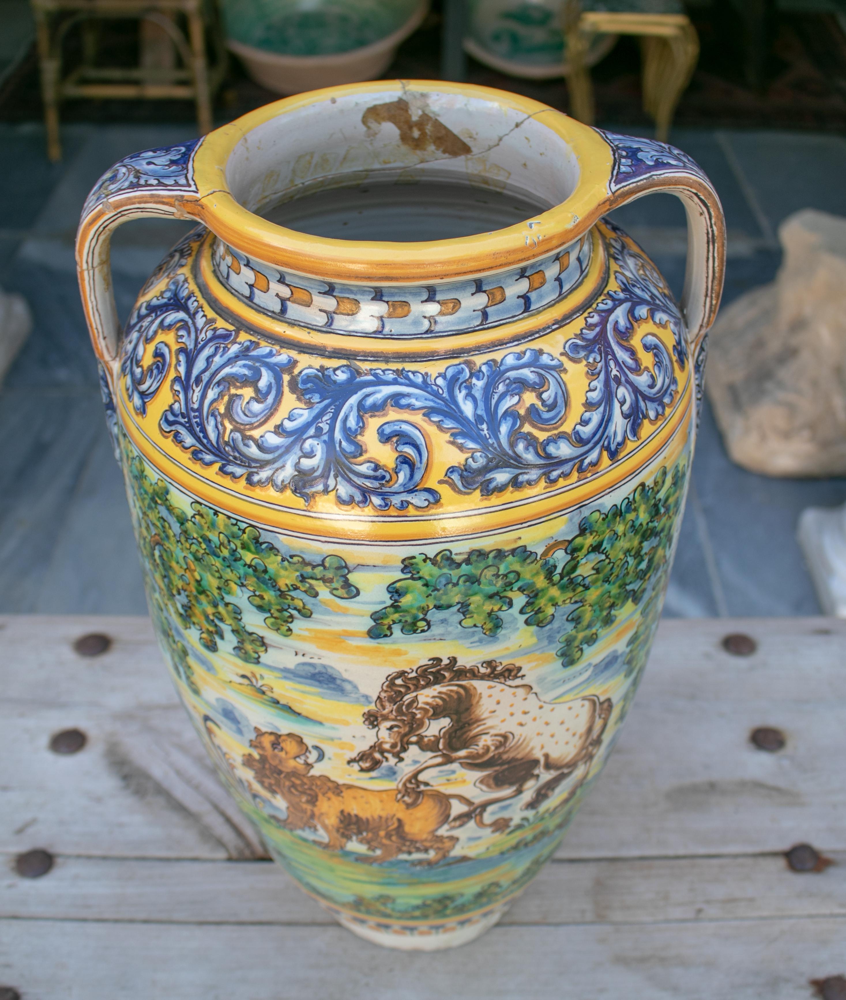 19th century Spanish Talavera porcelain vase with animals and horse rider scenes.