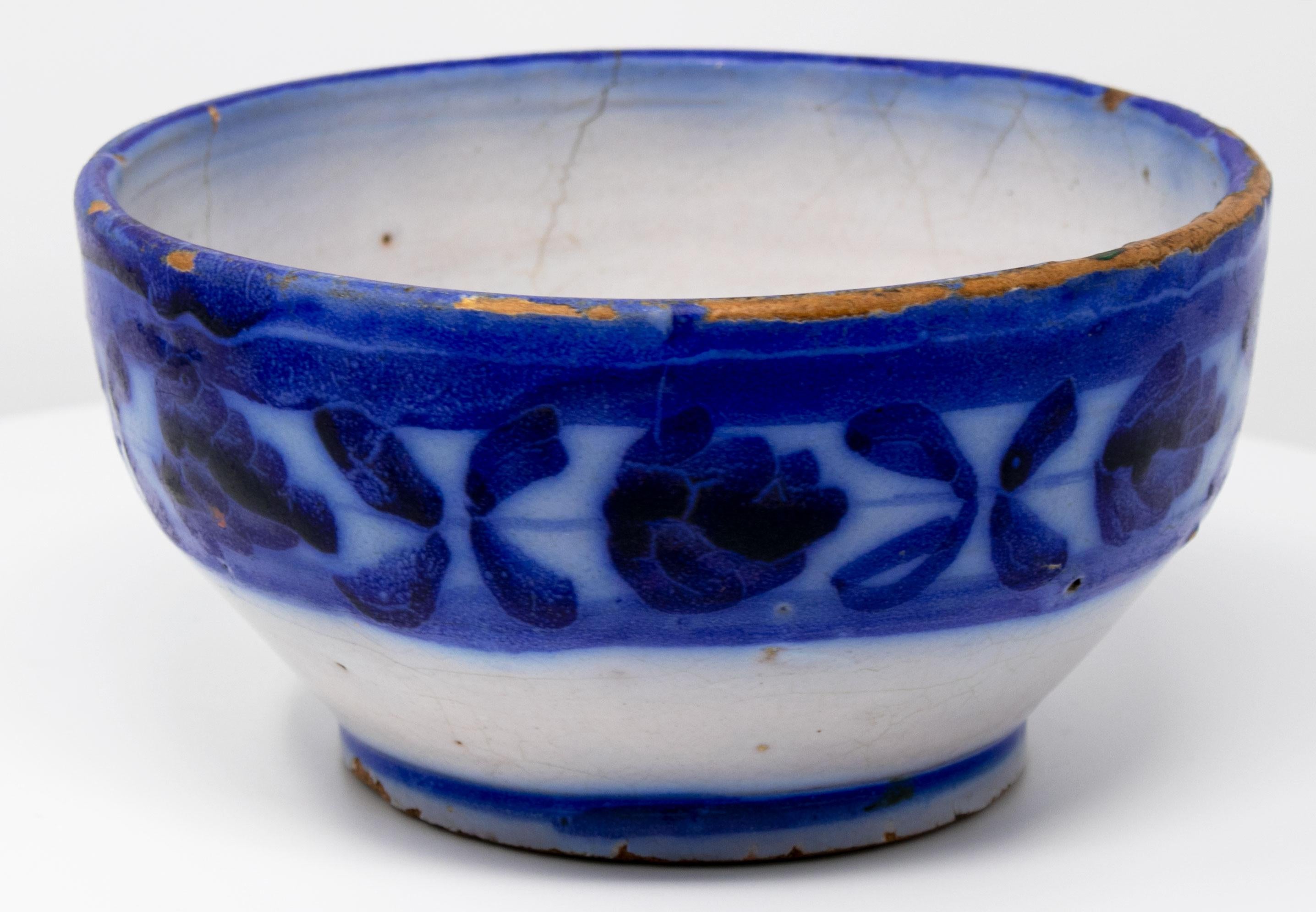19th century Spanish Talavera pottery white bowl with blue ornamental decorations.