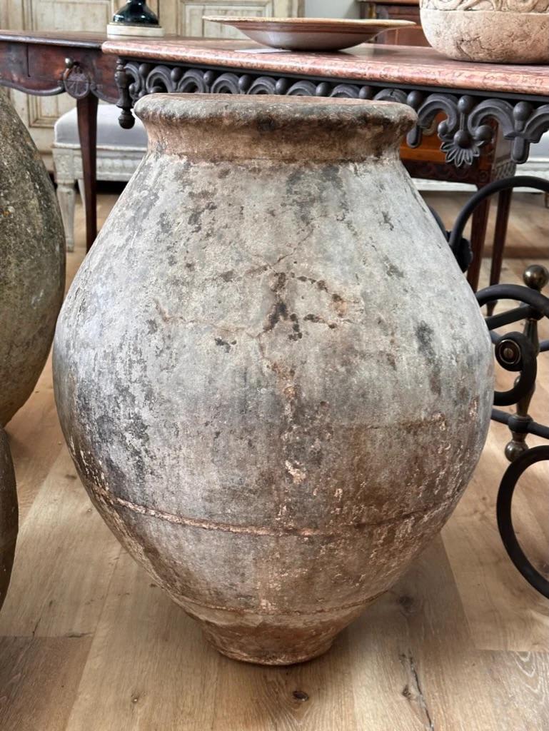 Spanish 19th Century jar with stamps including stars and rounded neck (earlier of the three) 30” h. x 22” d. 24” diam. 

