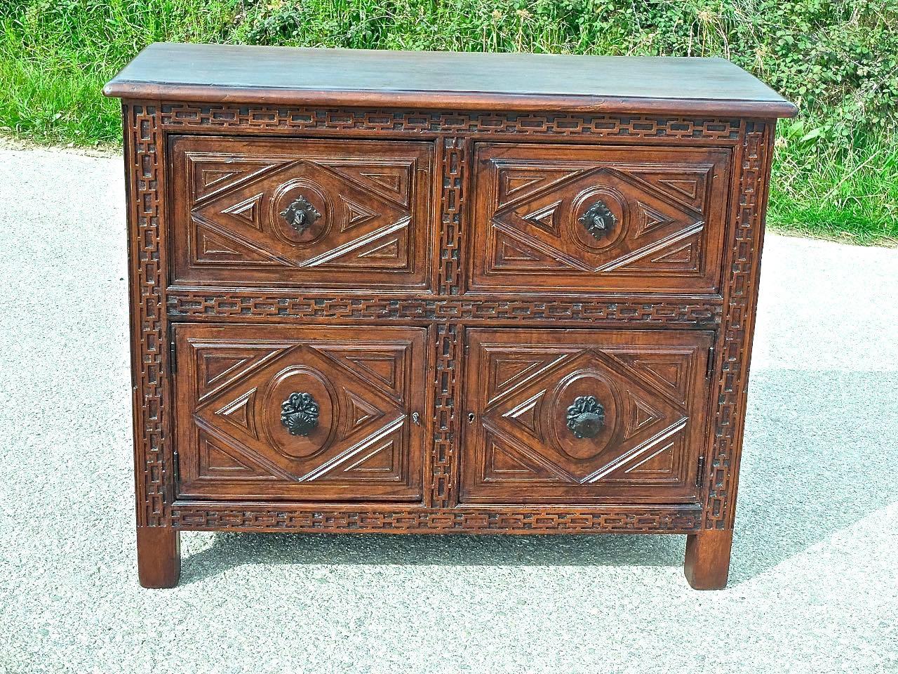 Found in the provincial capital of Burgos in Old Castile, Spain, this lovely two-drawer, two-door credenza is a perfect late 19th century replica of a classic 17th century Castilian 