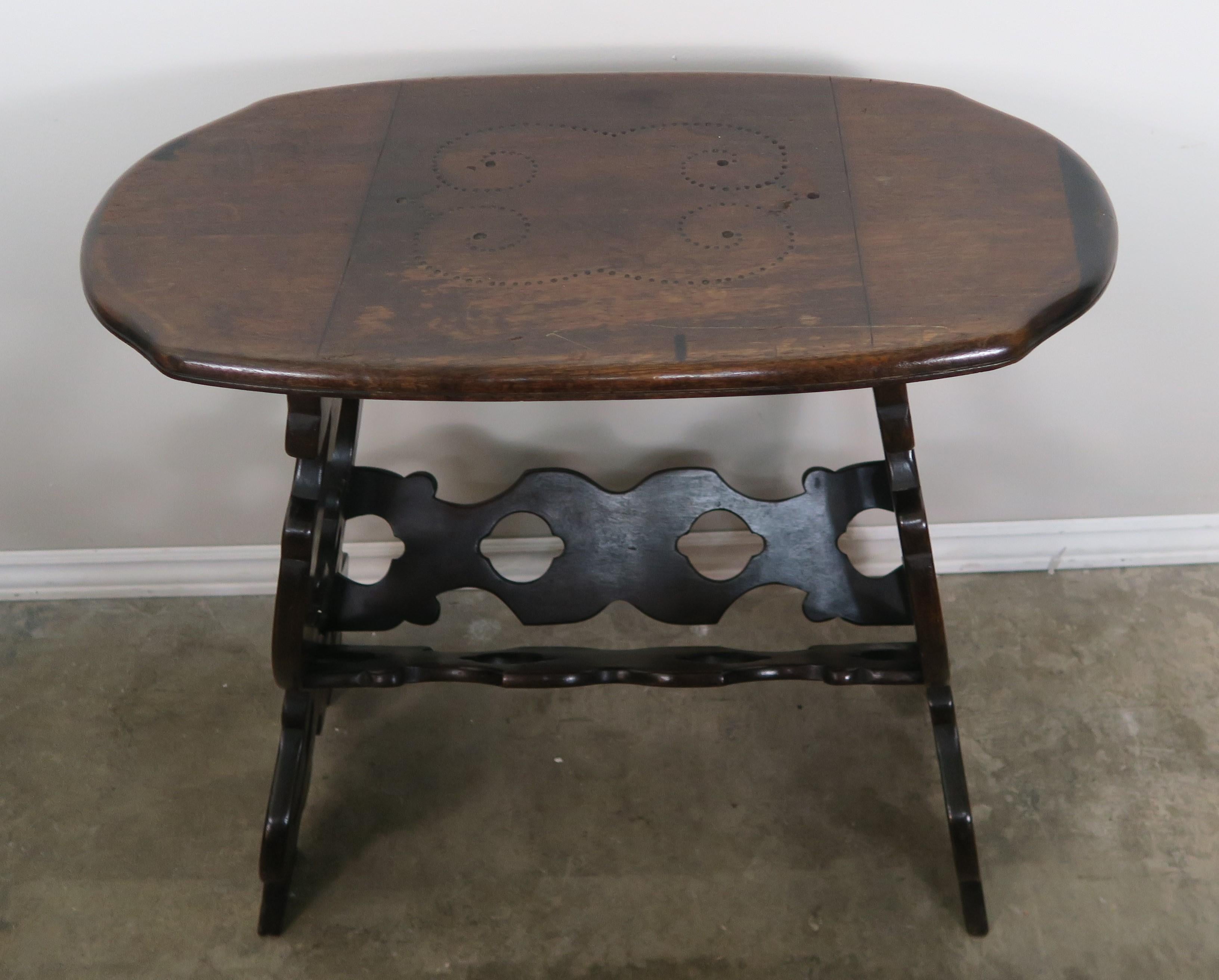 Charming 19th century oval shaped Spanish side table with design carved into top.
 