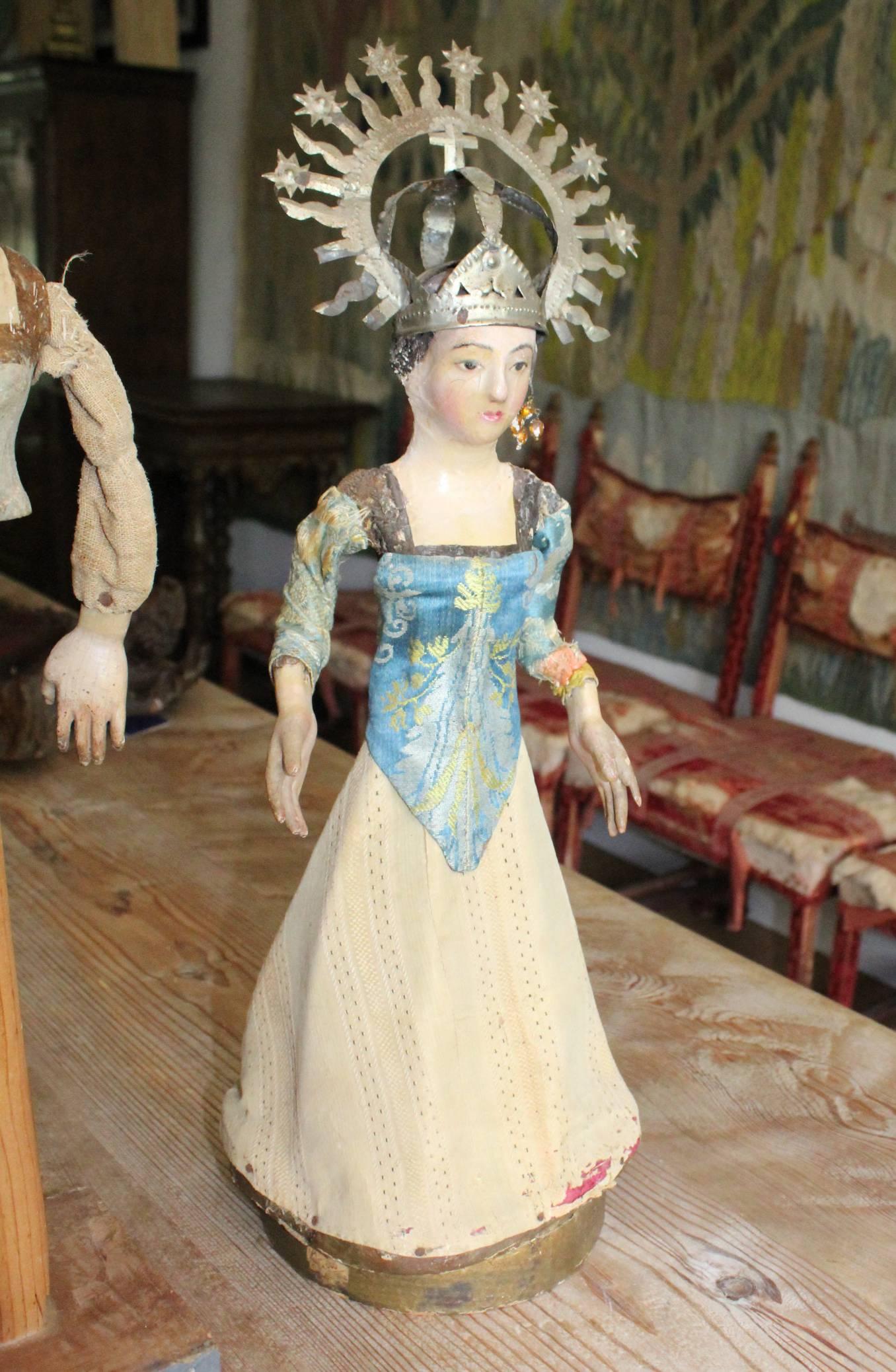 19th century Spanish wooden polychrome sculpture of the Virgin Mary with original clothing and tin crown.
 