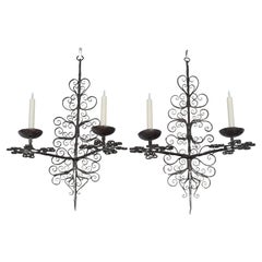 Pareja de candelabros españoles de hierro forjado del siglo XIX