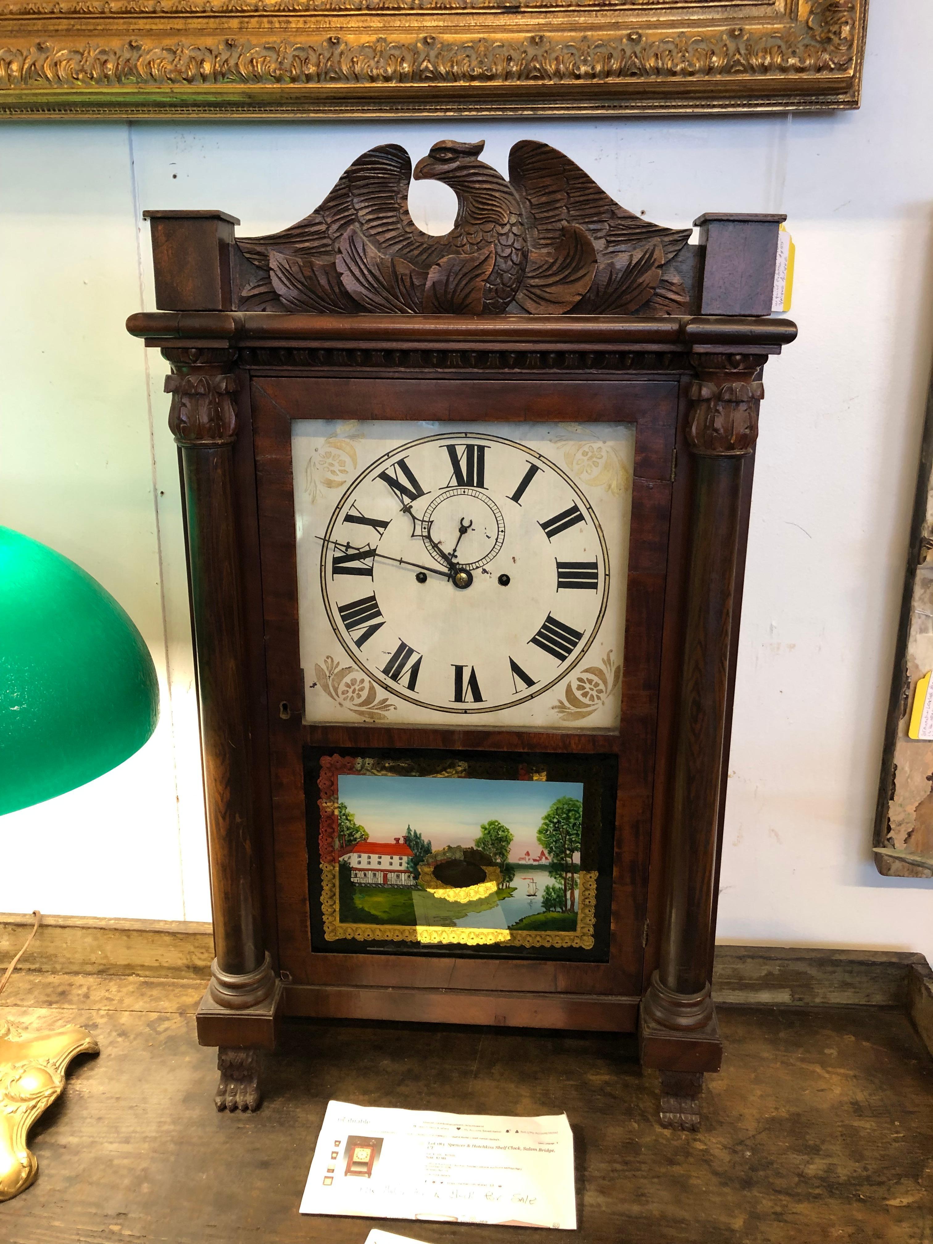 19th century beautiful Salem Bridge shelf clock having 8 day time and bell strike on the hour with second hand indicator.  Brass works, dpendable timekeeper.  Gorgeous carved wood with eagle at the top, columns on each side terminating in claw feet.