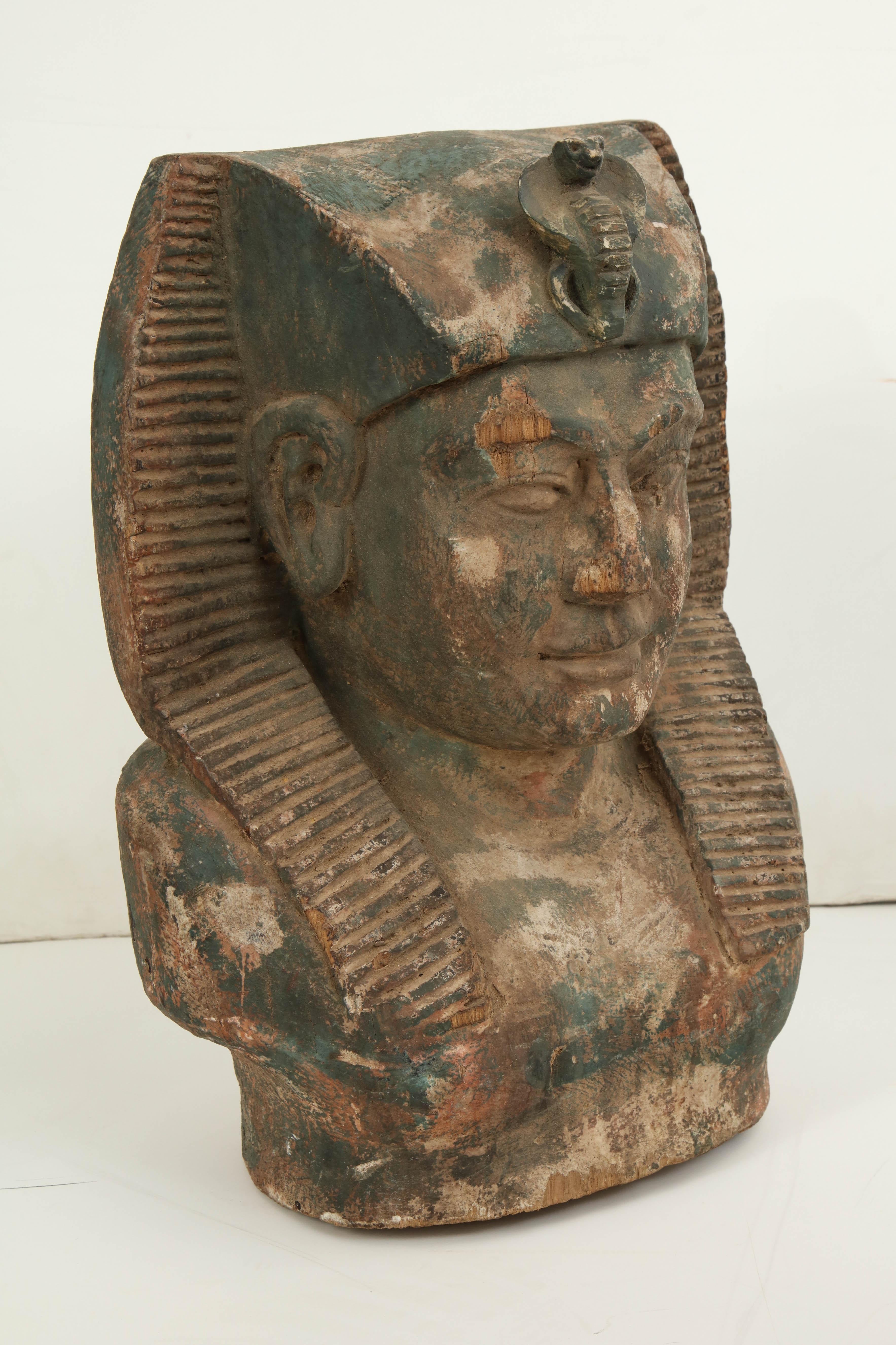An unusual carved wood Sphinx's head.