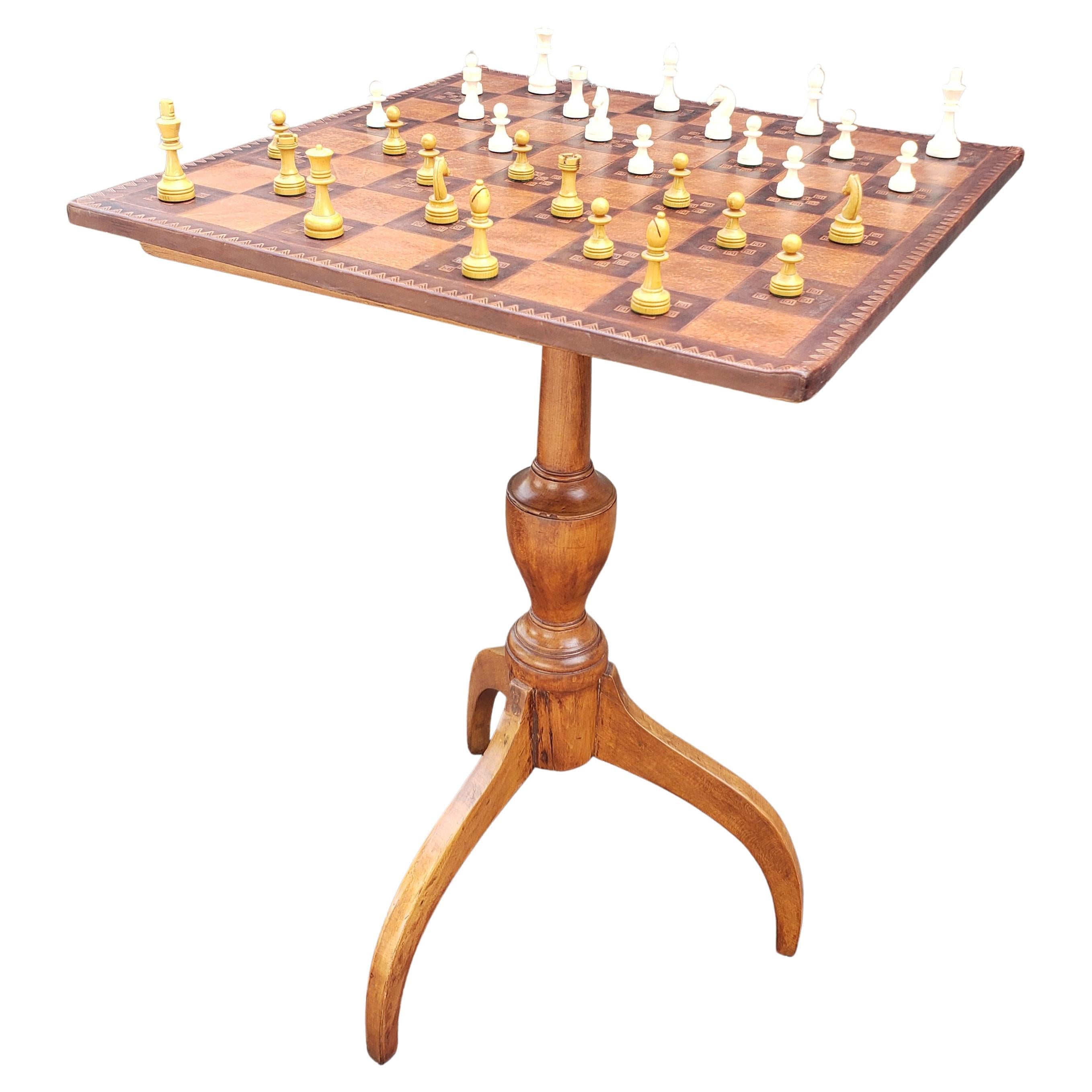 A 19th century victorian Spider Legs Maple Table and Leather Top Chess Board and Pieces Set in good antique and condition. Great has great patina and comes with newer, actual leather chess board and pieces. Tbale measures 16.5