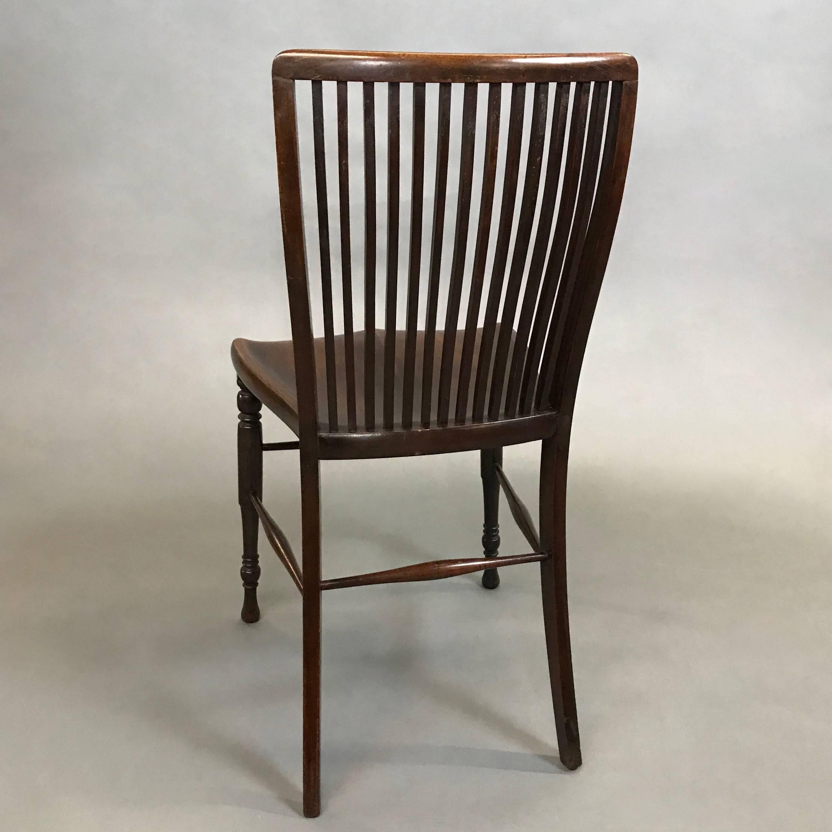 Antique, mahogany, accent, side chair circa 1860s features a curved, spindle back with turned front legs.