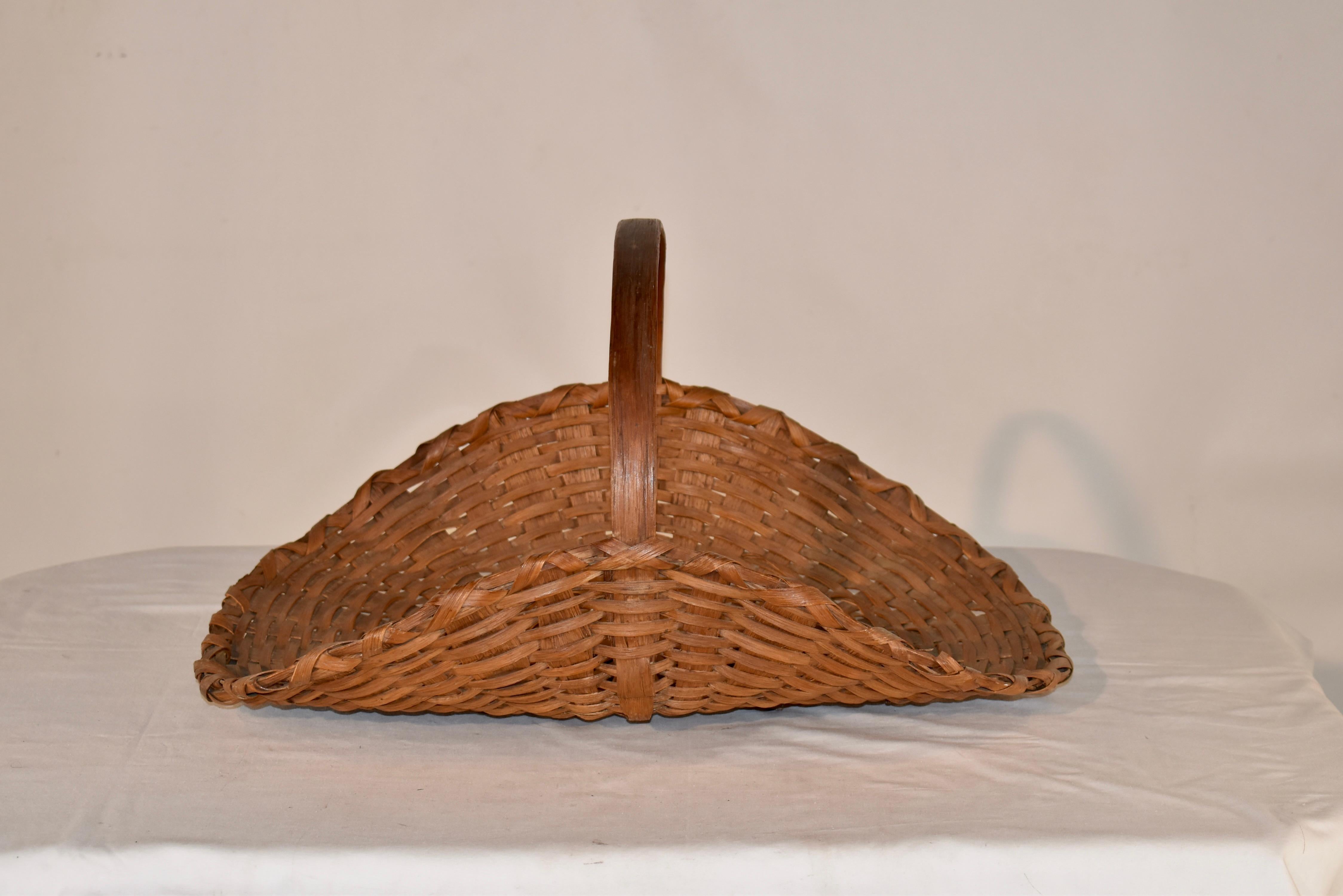 19th century split oak hand woven basket for flower gathering.  This is a wonderful example of an American basket that has been in use for over a century, gathering happiness and beauty!  