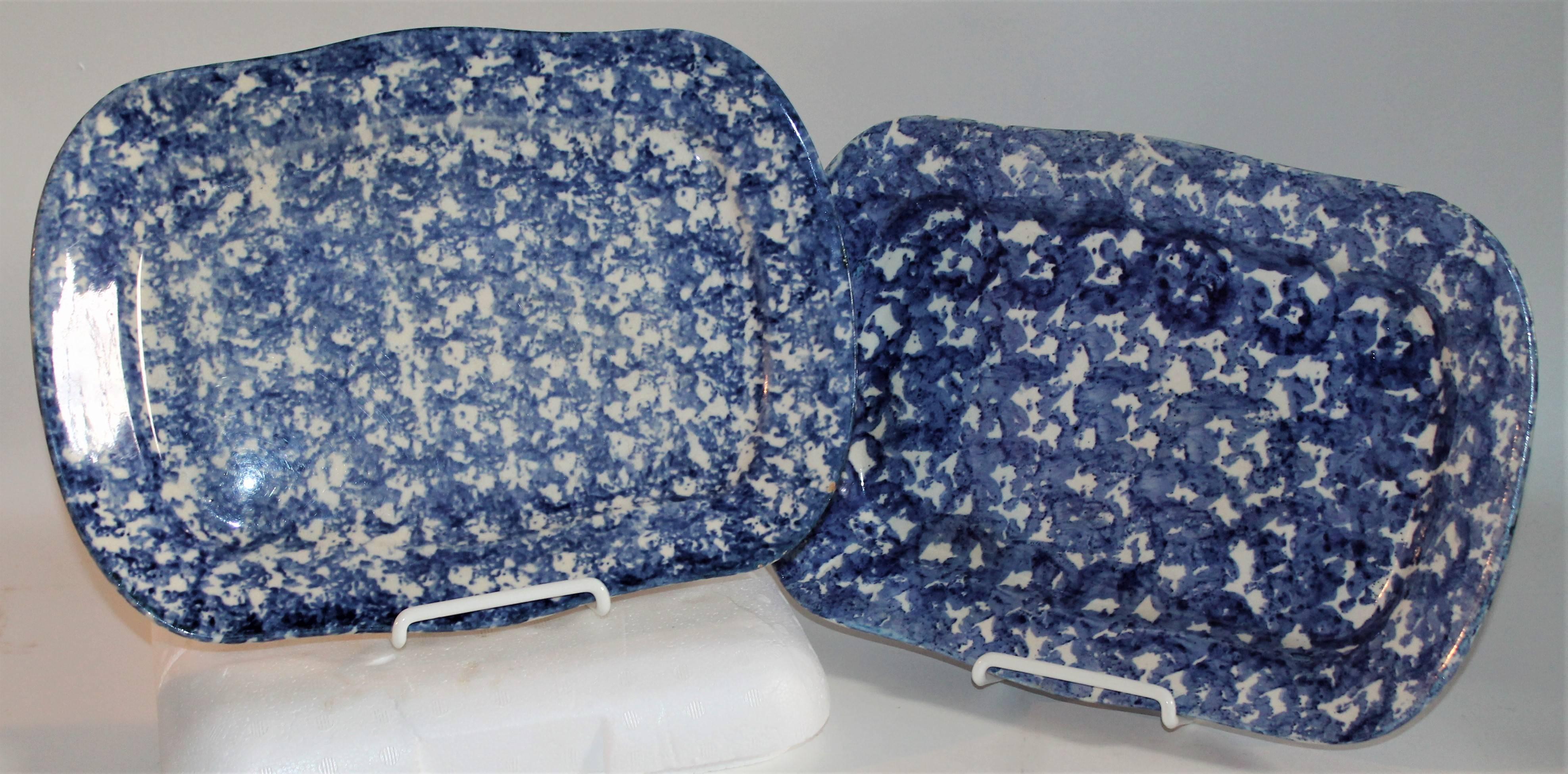 These patterned sponge ware rectangular serving platters are in pristine condition. Wonderful colors both front and back.