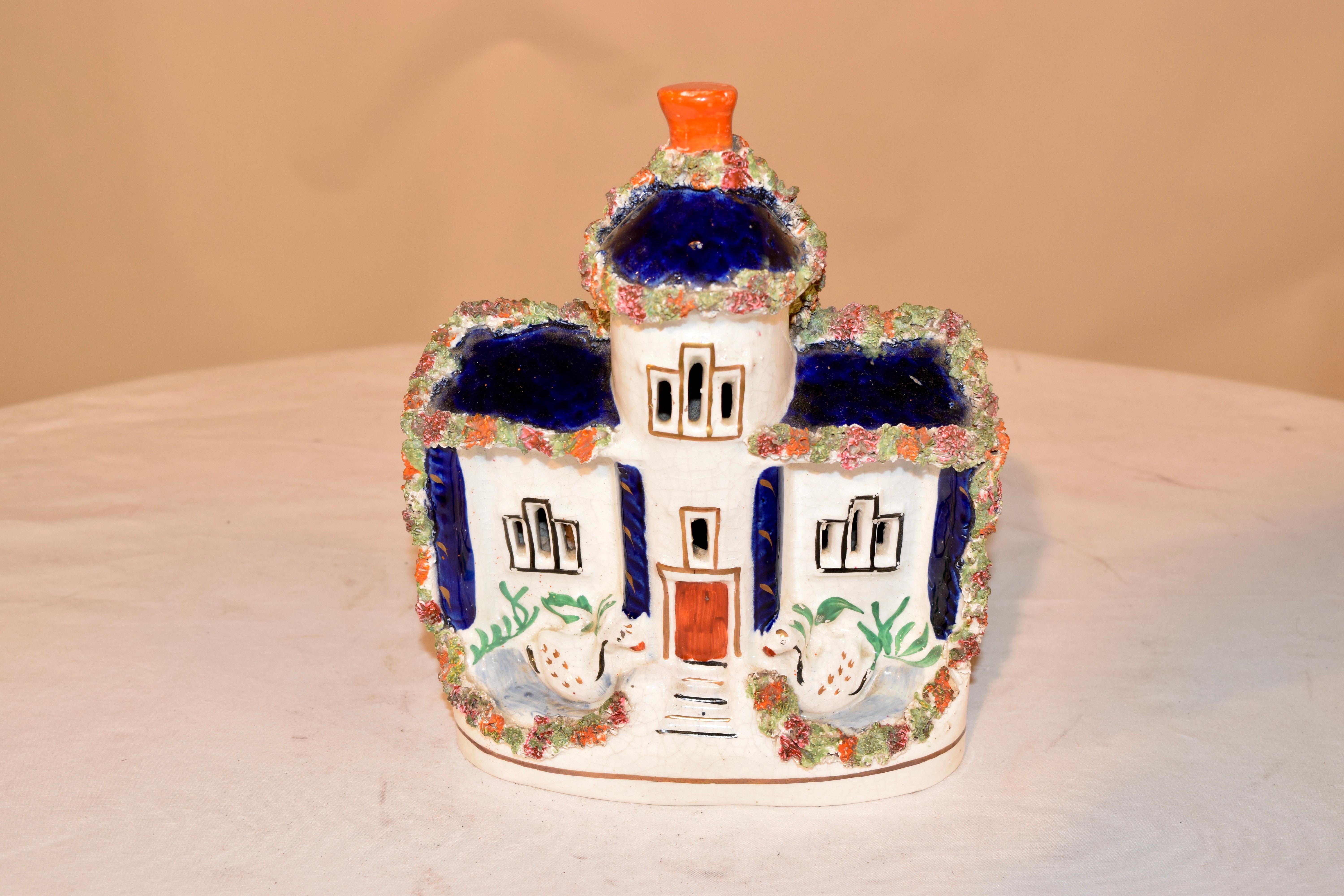 19th century Staffordshire cottage from England with swans flanking the front door and a cobalt room with flocking detail. Lovely form.