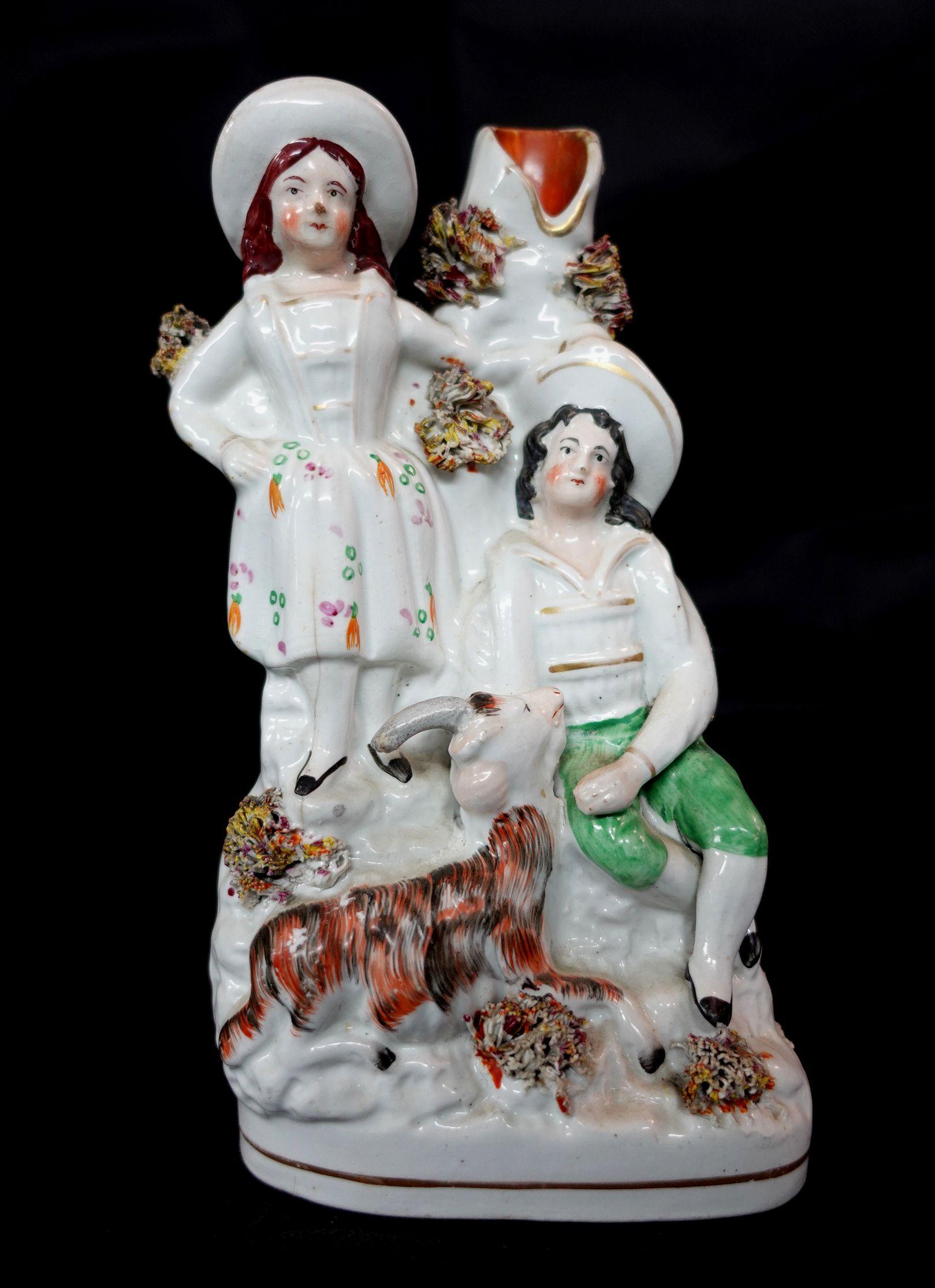 19th century English Staffordshire figure, signed at the bottom.


 