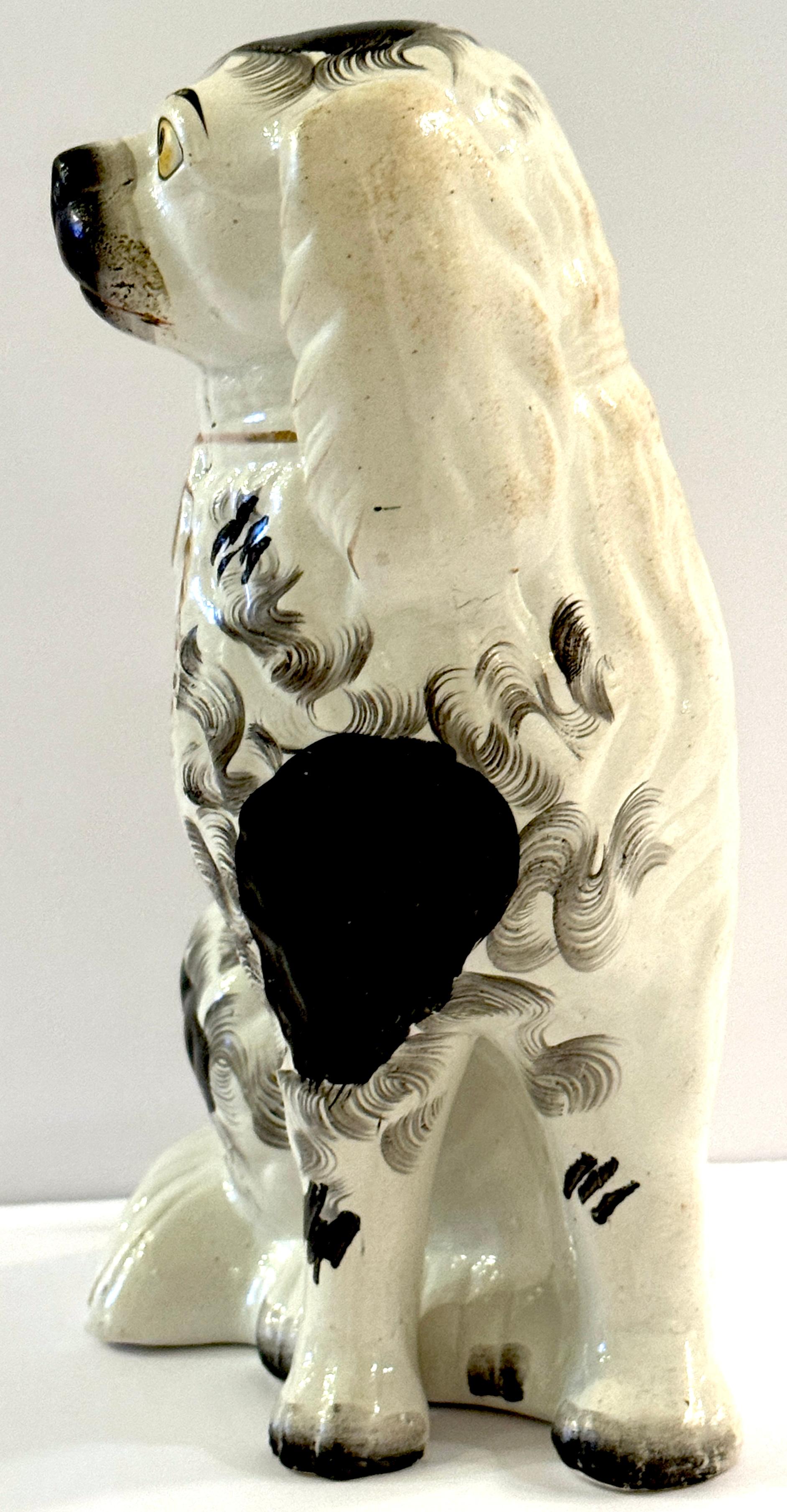 19th Century Staffordshire Unique Black & White Spaniel with Separated Foot For Sale 4