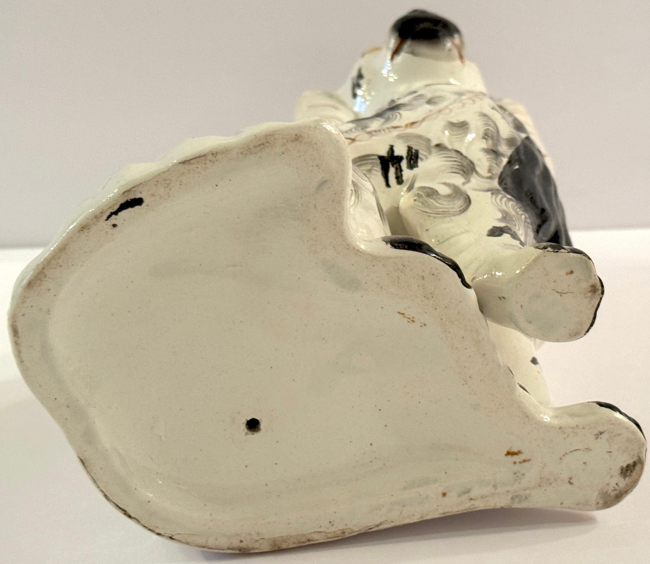 19th Century Staffordshire Unique Black & White Spaniel with Separated Foot For Sale 5