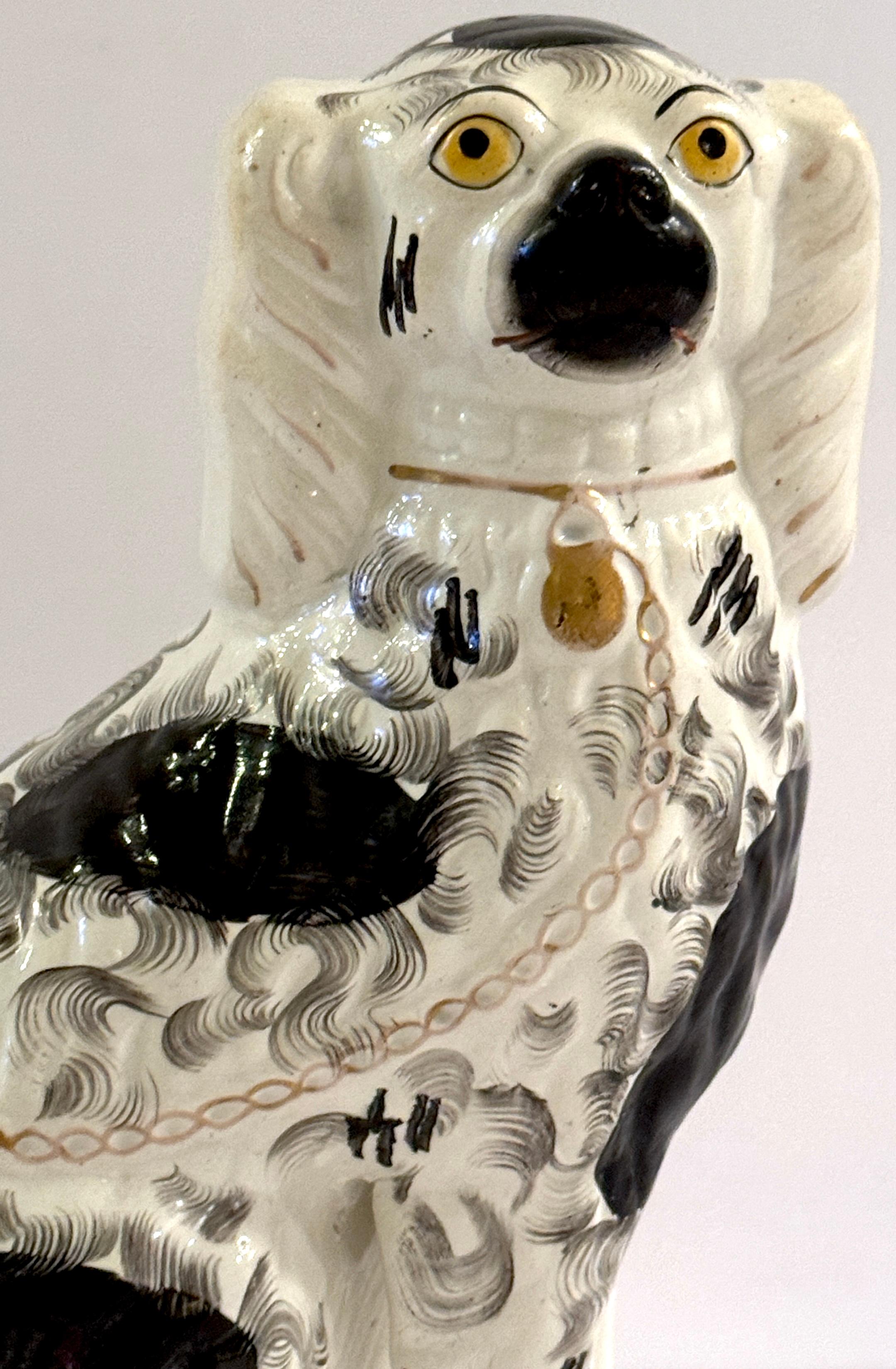 English 19th Century Staffordshire Unique Black & White Spaniel with Separated Foot For Sale