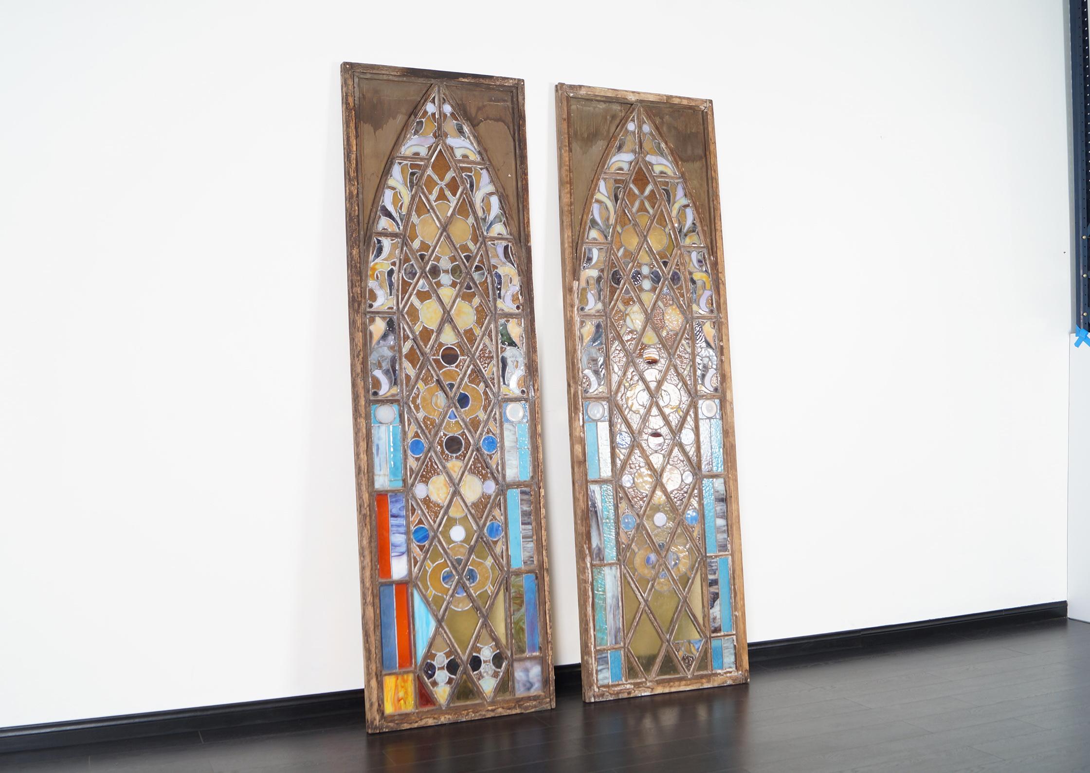 Remarkable large vintage 19th century stained glass window made in the United States. These stained glass windows represent through their entire structure the Gothic movement in the best possible way. Each stained glass window has fine mosaics