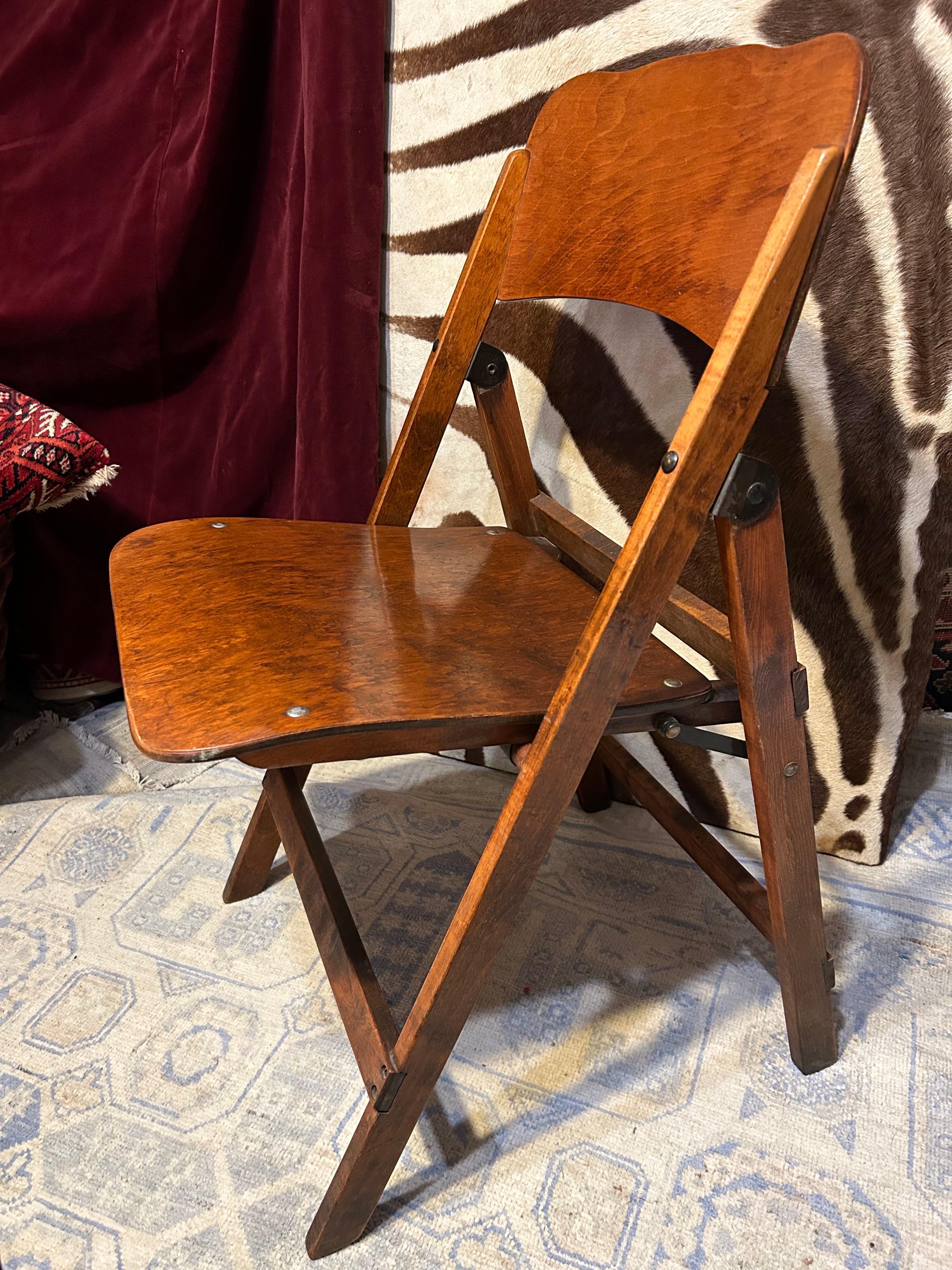 Solid, beautifully conceived folding Campaign chair with excellent attention to detail. Metal rivets and pivot hardware intact and functioning smoothly. this chair will take use as it is sturdy and functional while exuding old world splendour. The