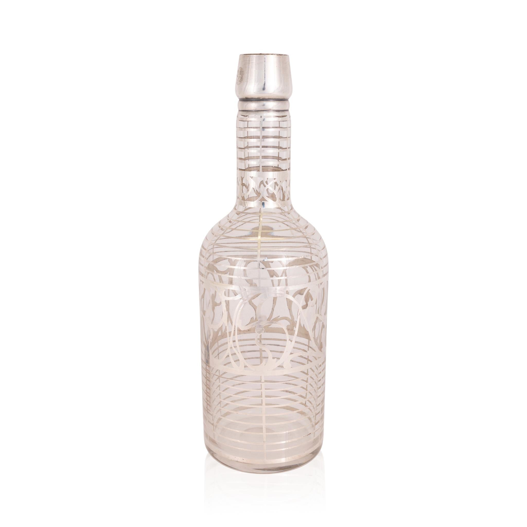 Back bar bottle with sterling overlay. Features a beautiful art nouveau style design. 

Period: Last quarter of the 19th century
Origin: United States
Size: 3 1/2