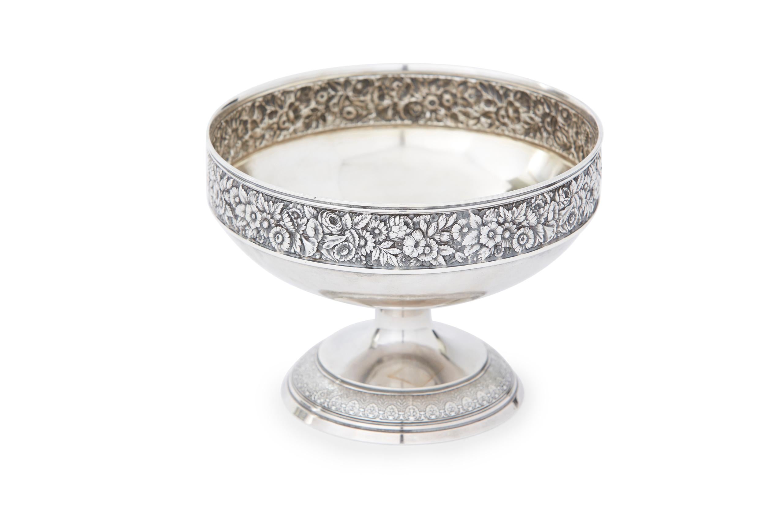Mid 19th century sterling silver footed centerpiece bowl with exterior floral band design details and gold wash interior. The centerpiece bowl is in great antique condition. Minor wear consistent with age / use. Maker's mark and date undersigned.