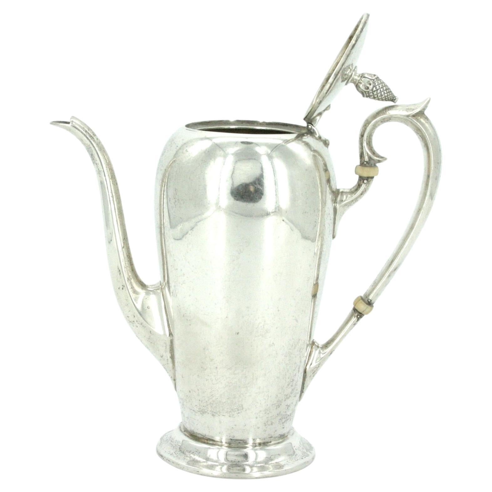 Mid-19th century English sterling silver chocolate / coffee tea pot with a very clean line design. The chocolate or coffee pot is in great condition. Minor wear consistent with age / use. Maker's mark undersigned. The pot hold only 1 1/2 pints. It