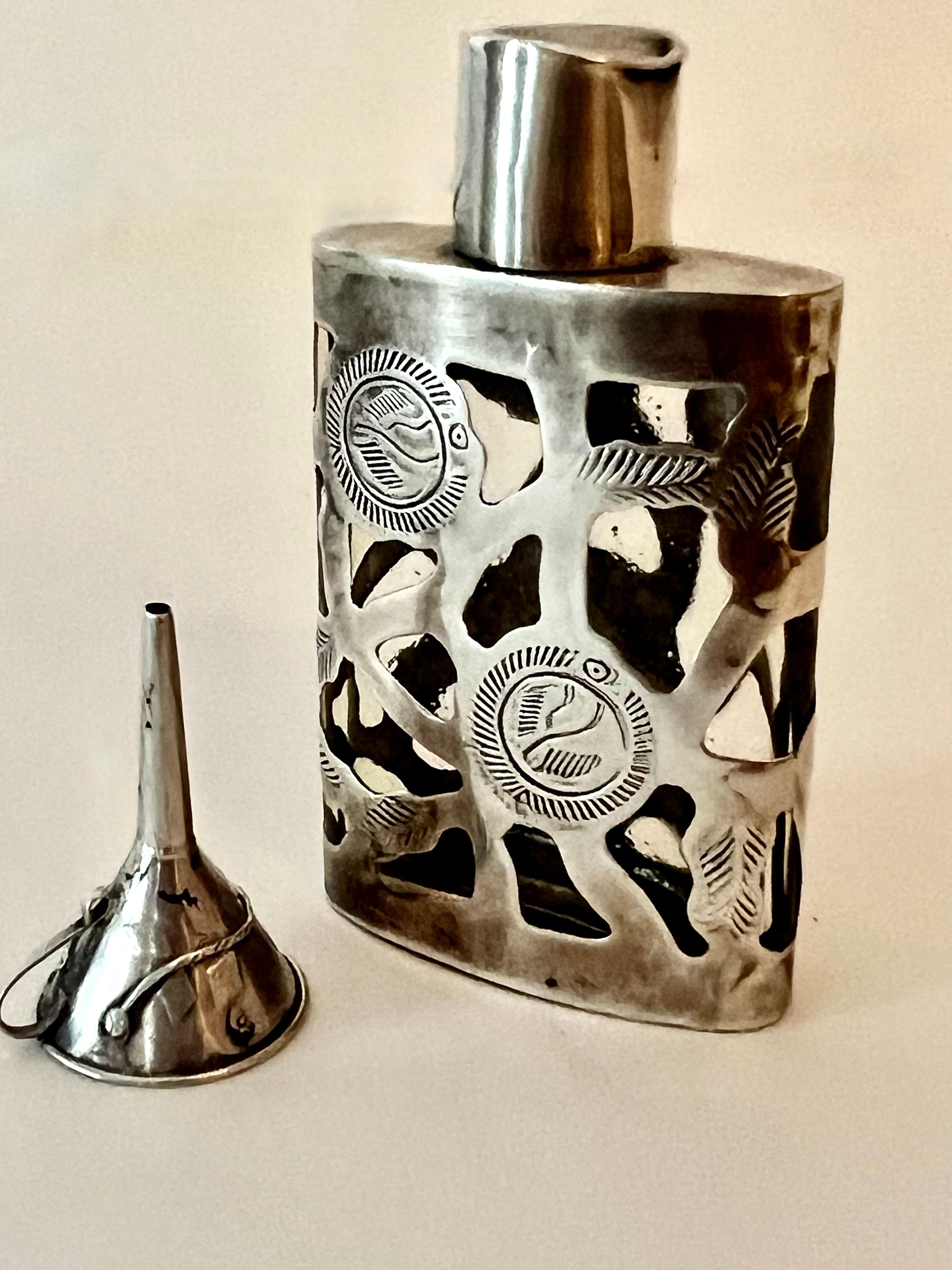 A Mexican Sterling Siver Filagree perfume bottle with Sterling funnel - the duo are quite attractive and ready to use!  great for travel or just to decorate your vanity or dressing table.