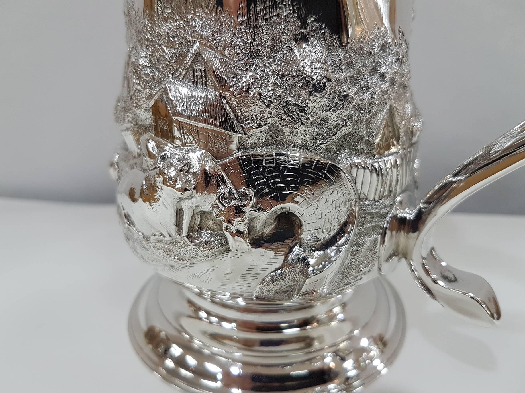 Sterling silver half-pint tankard or mug with repuosse Contryside scene by
John Langlands I &
John Robertson
(prolific makers, tankards and mugs)

350 grams.


