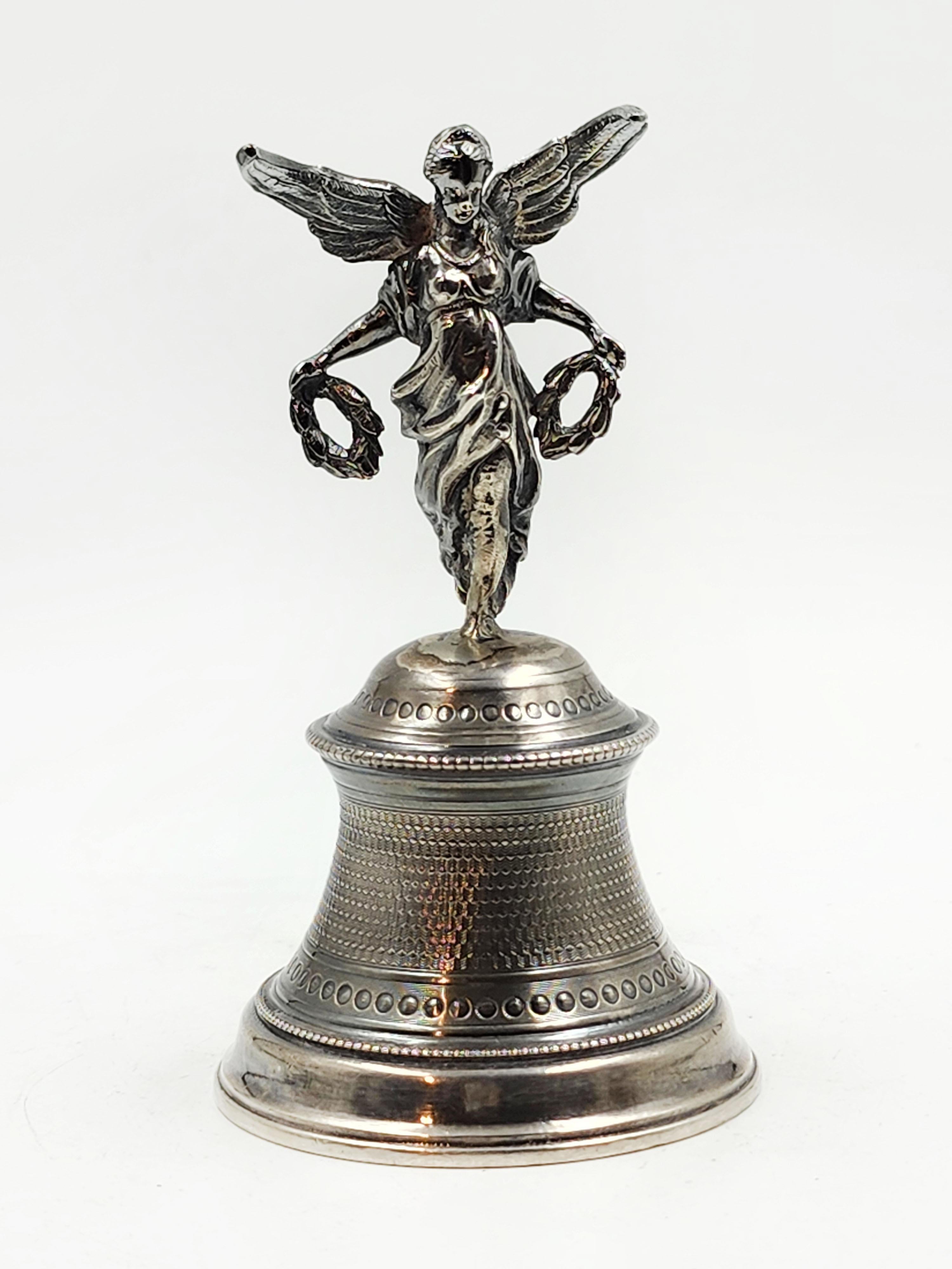 19th century sterling silver French bell
Beautiful sterling silver religious bell with a representation of an angel with open wings with laurel wreaths, and the bell itself has an intricate design.
Measures:
Height: 11.5 centimeters
Diameter: 6.5