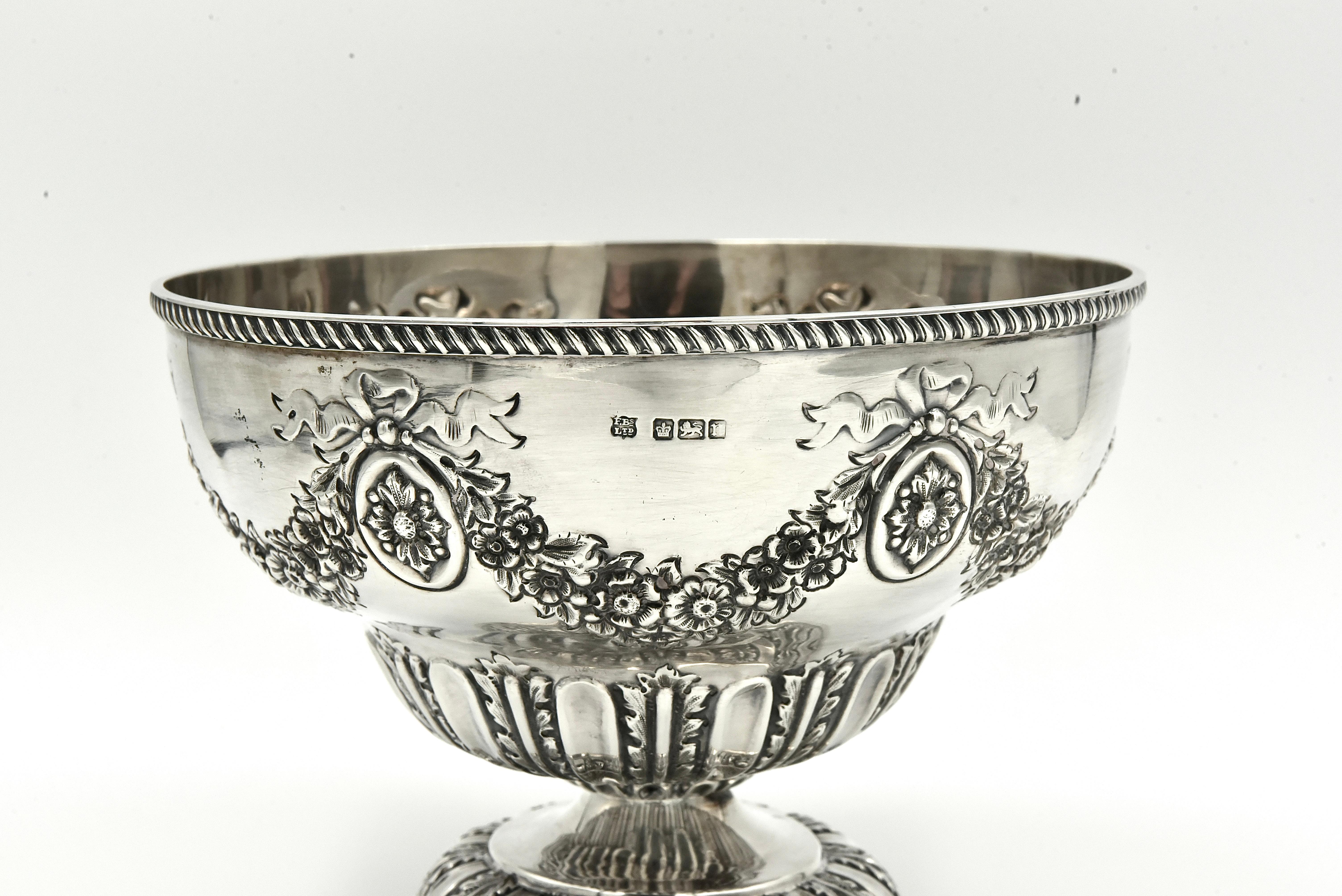 A superb sterling silver fruit bowl ,
 It is a very decorative piece of silver with swag and ribbon decoration that really does catch the eye. The thick gauge of silver used gives it a lovely deep shine and a solid feel to handle.
Fully hallmarked