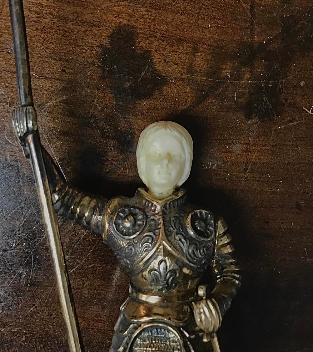 19th-century sterling silver Vermeil German Joan Of Arc in full armor with a staff. Silver body with a carved face holding a Staff and with a coat-of-armour. The square pedestal base features hand engraved scrolling all the way around the base and